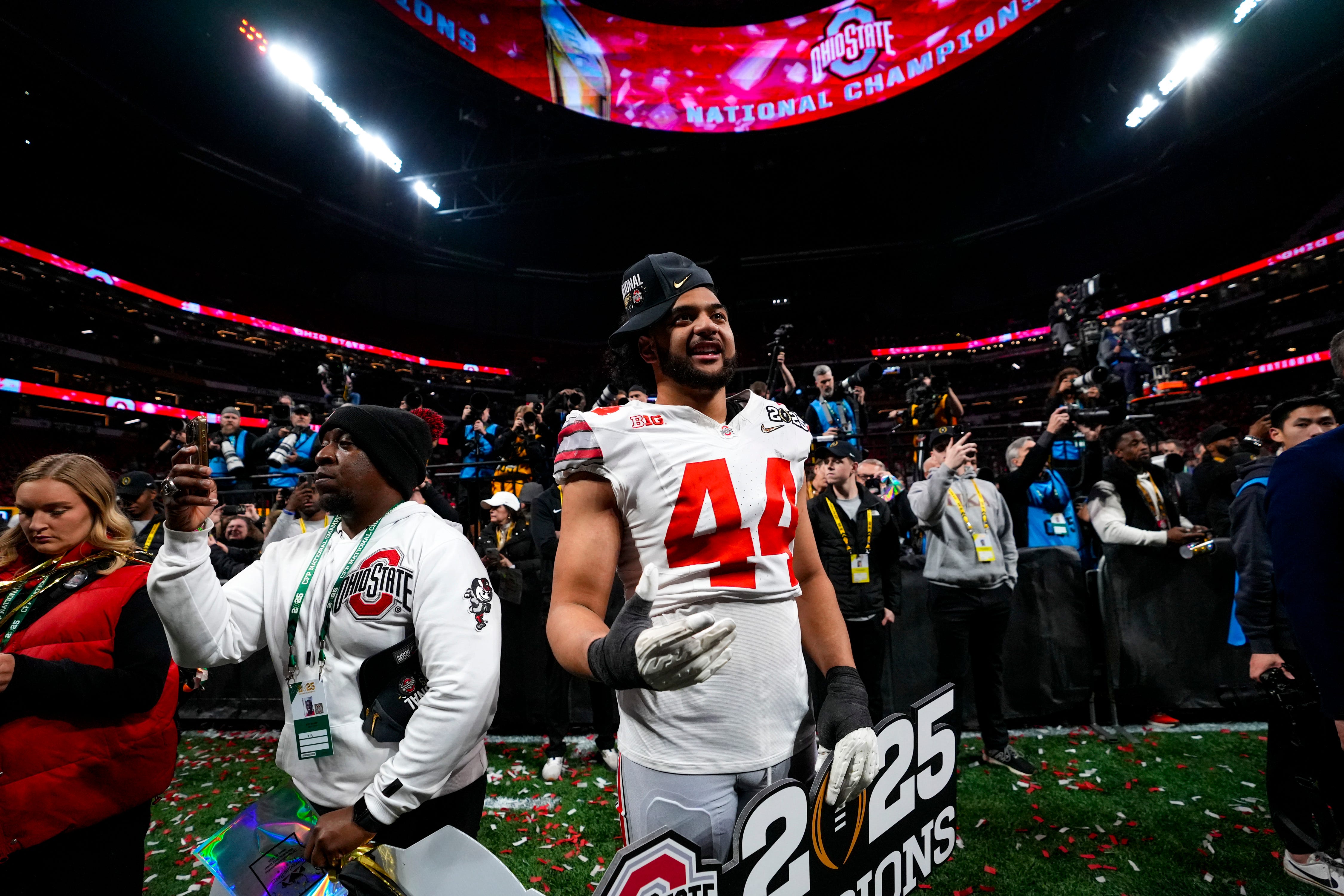 Ohio State Buckeyes defensive end JT Tuimoloau (44) celebrates after defeating Notre Dame Fighting Irish in the College Football Playoff championship game at Mercedes-Benz Stadium in Atlanta on Jan. 21, 2025.