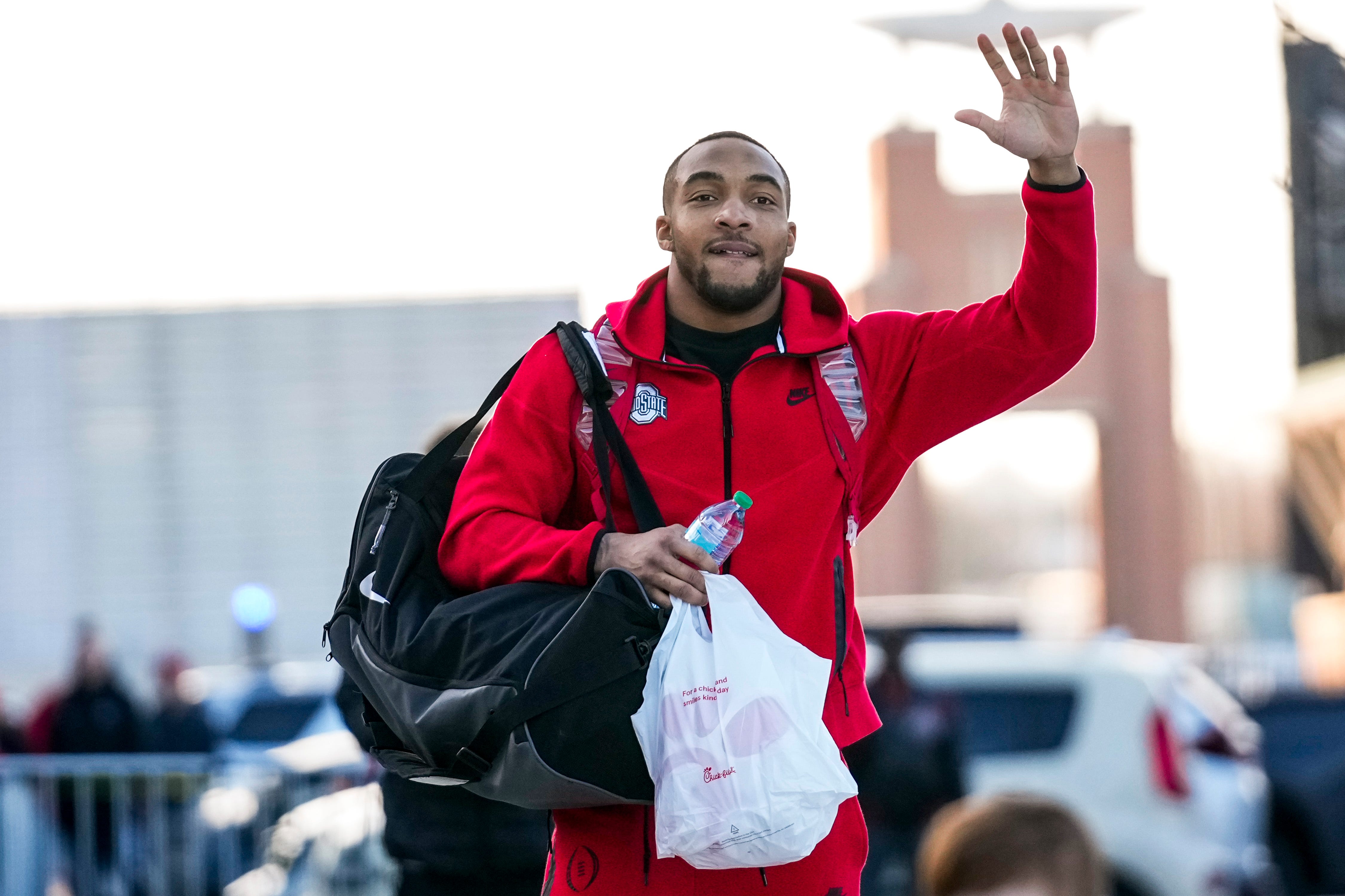 Ohio State Buckeyes running back TreVeyon Henderson (32) waves as fans cheer to send the Buckeyes off to Georgia for the National Championship game outside the Woody Hayes Athletics Center on Friday, Jan. 17, 2025 in Columbus, Ohio