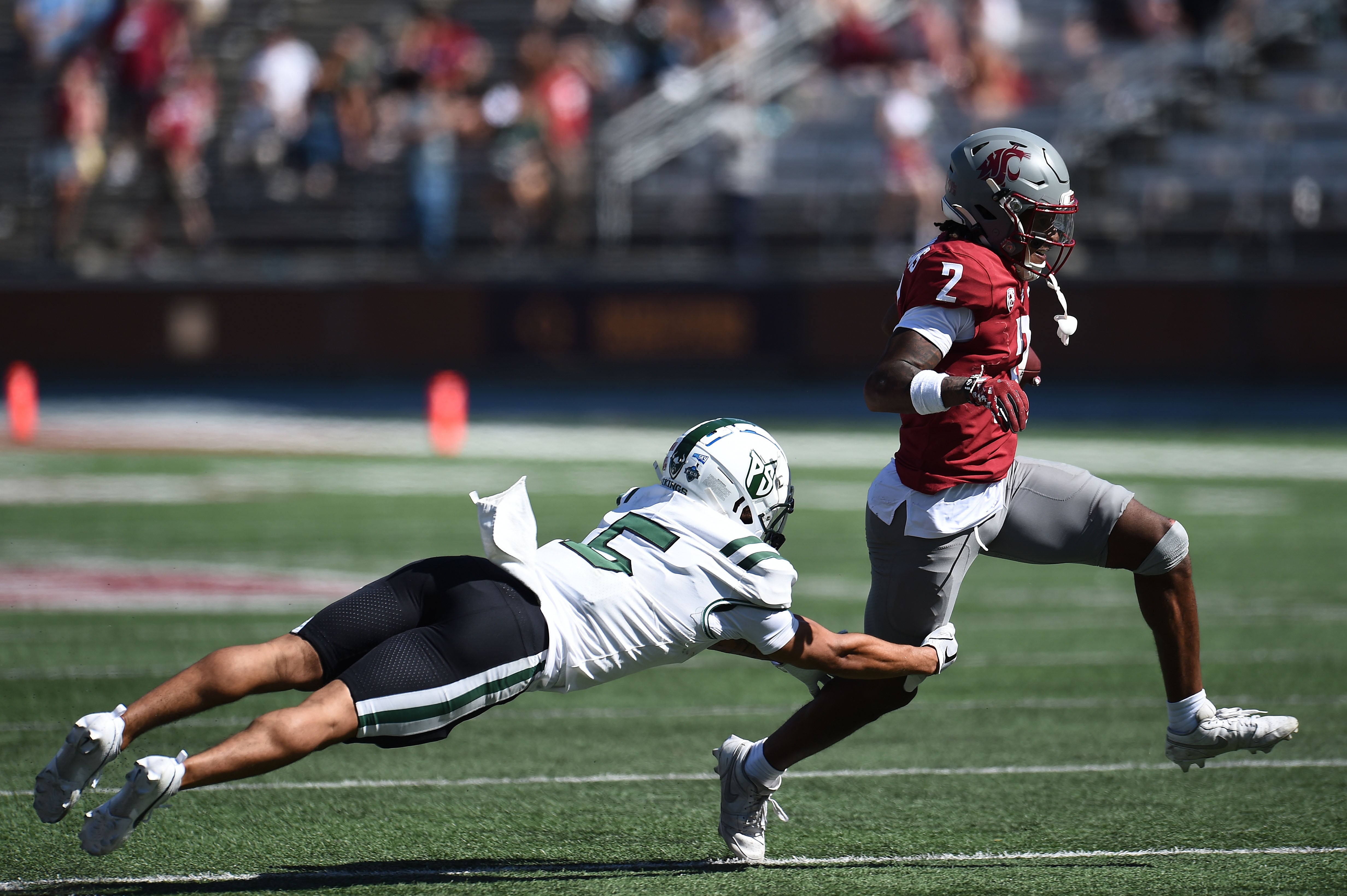 Aug 31, 2024; Pullman, Washington, USA; Washington State Cougars wide receiver Kyle Williams (2) breaks the table of Portland State Vikings safety Tyreese Shakir (5) in the second half at Gesa Field at Martin Stadium.