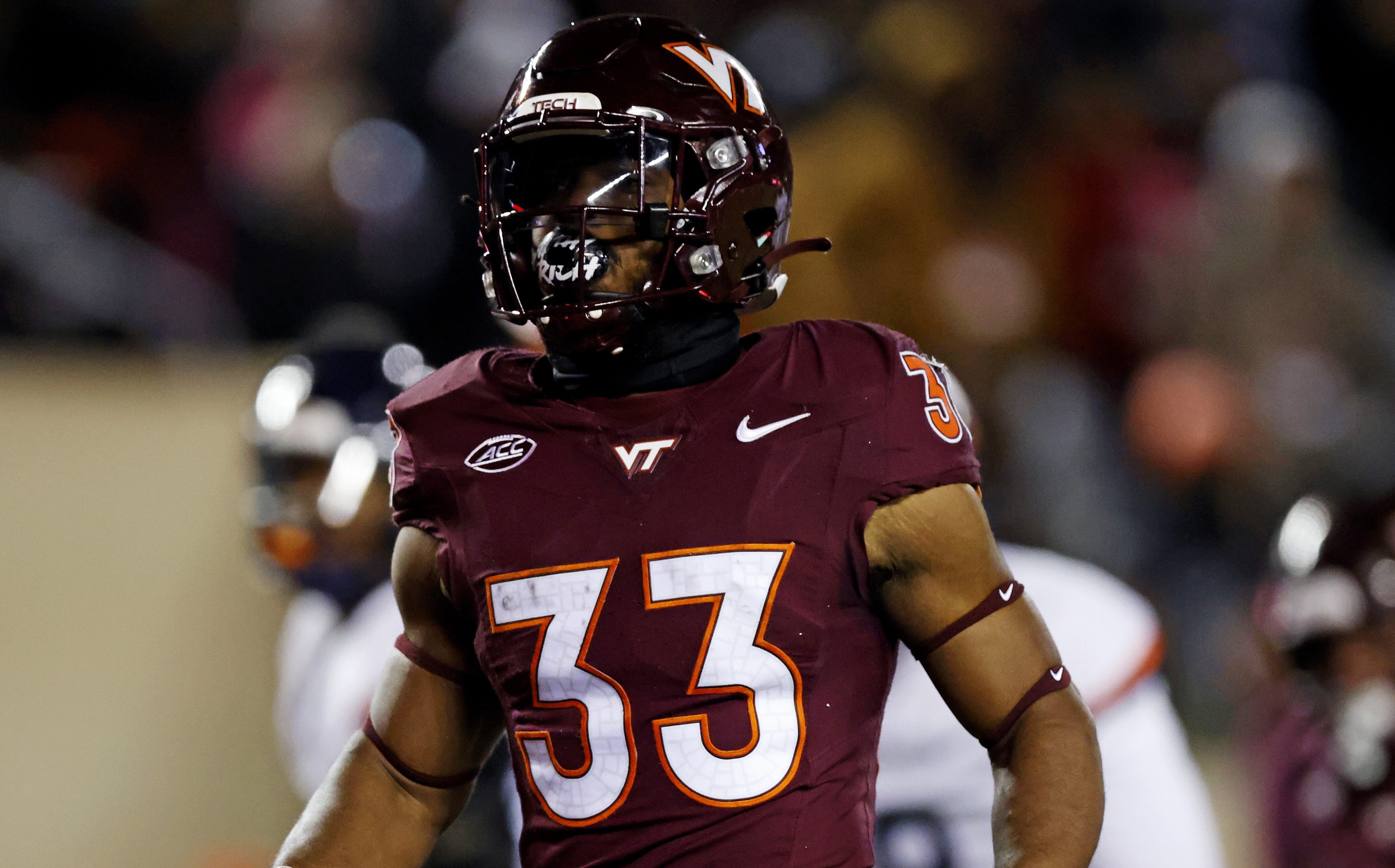 Nov 30, 2024; Blacksburg, Virginia, USA; Virginia Tech Hokies running back Bhayshul Tuten (33) runs for a touchdown during the first quarter against the Virginia Cavaliers at Lane Stadium.