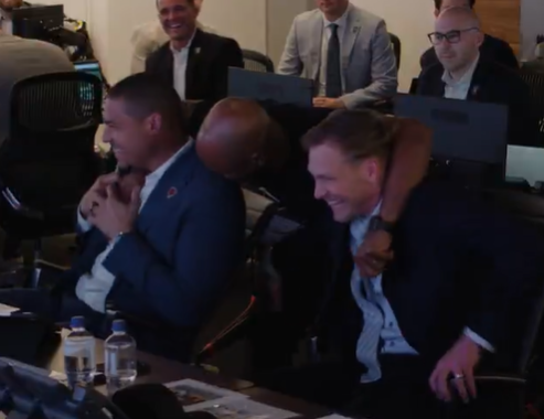 Chicago Bears draft room celebrates after drafting WR Luther Burden III in the second-round.