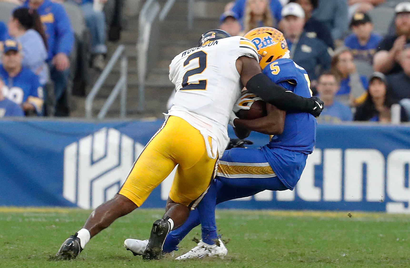 Oct 12, 2024; Pittsburgh, Pennsylvania, USA; California Golden Bears defensive back Craig Woodson (2) tackles Pittsburgh Panthers wide receiver Raphael Williams Jr. (5) during the fourth quarter at Acrisure Stadium. Pittsburgh won 17-15.