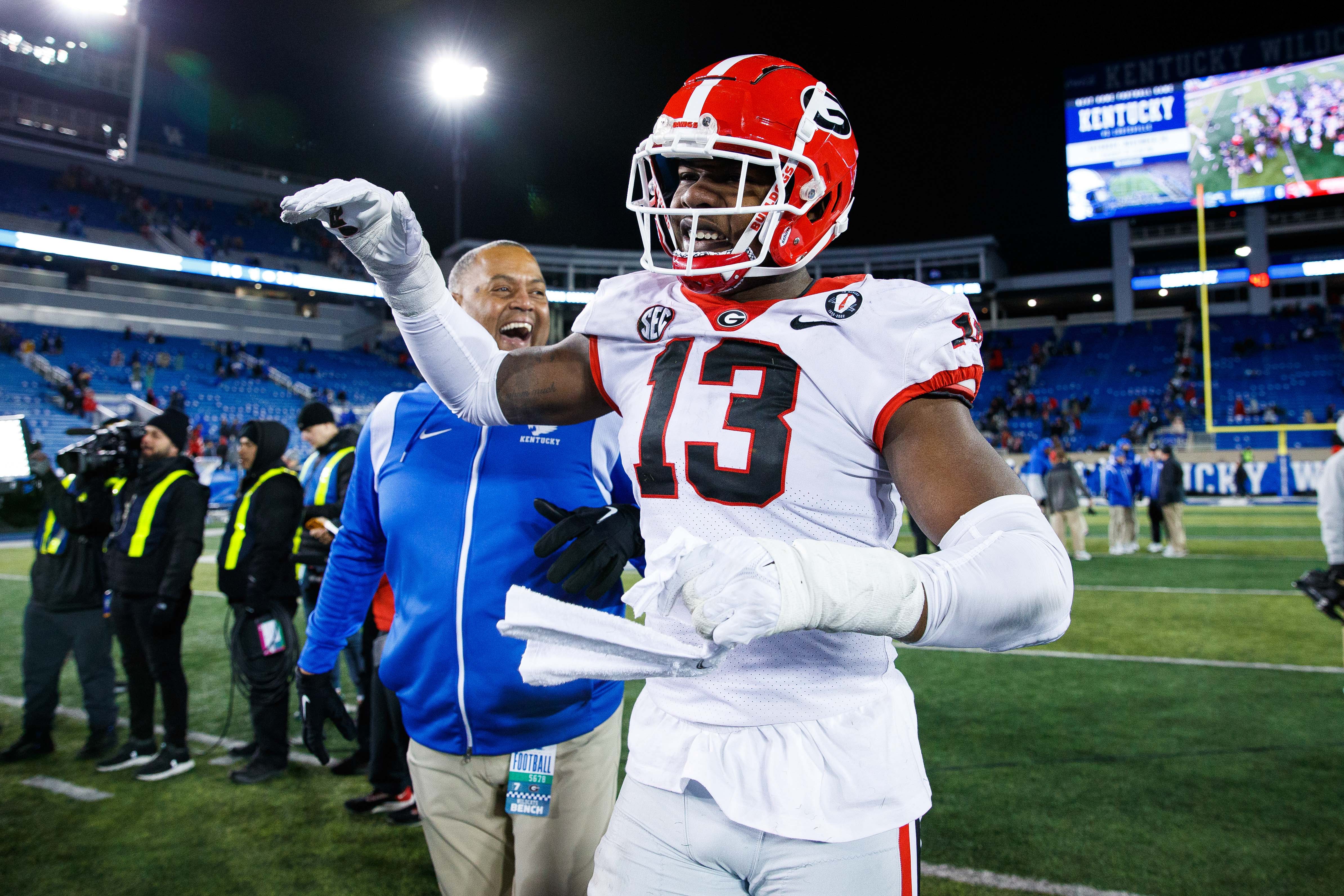 Georgia Bulldogs defensive lineman Mykel Williams (13) celebrates after the game against the Kentucky Wildcats at Kroger Field.