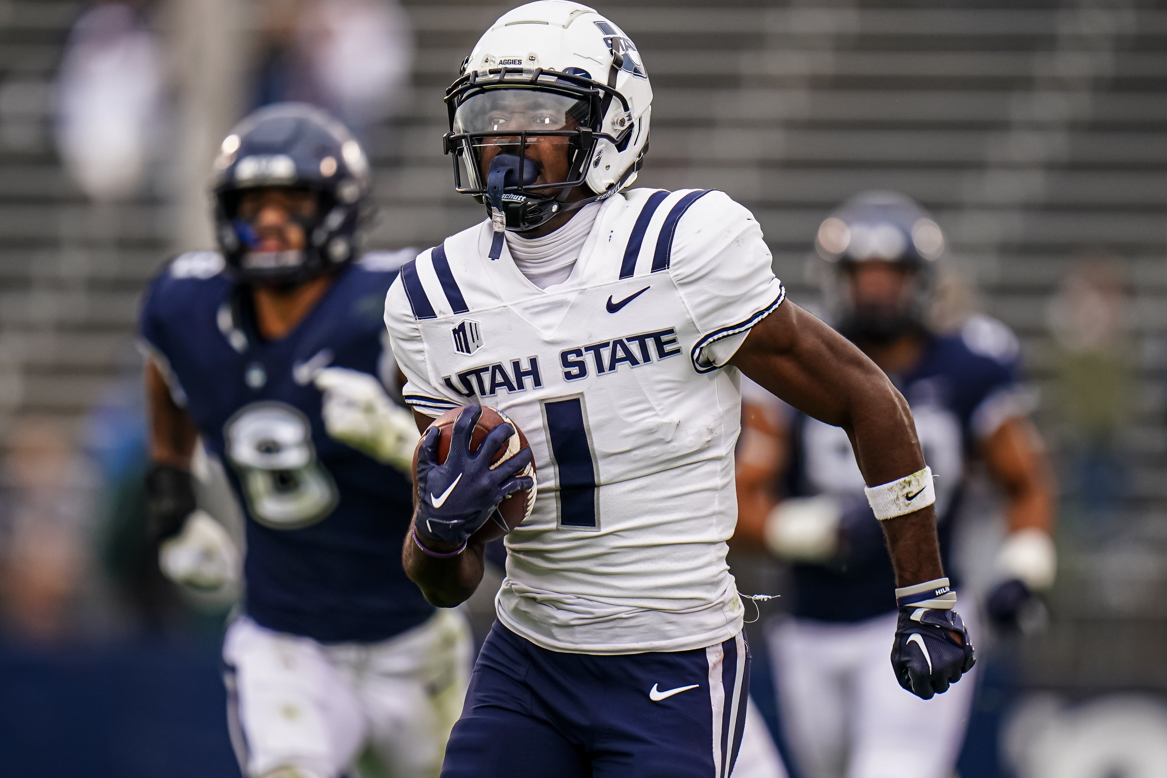 Sep 30, 2023; East Hartford, Connecticut, USA; Utah State Aggies wide receiver Jalen Royals (1) runs the ball for a touchdown against the UConn Huskies in the second half at Rentschler Field at Pratt & Whitney Stadium.