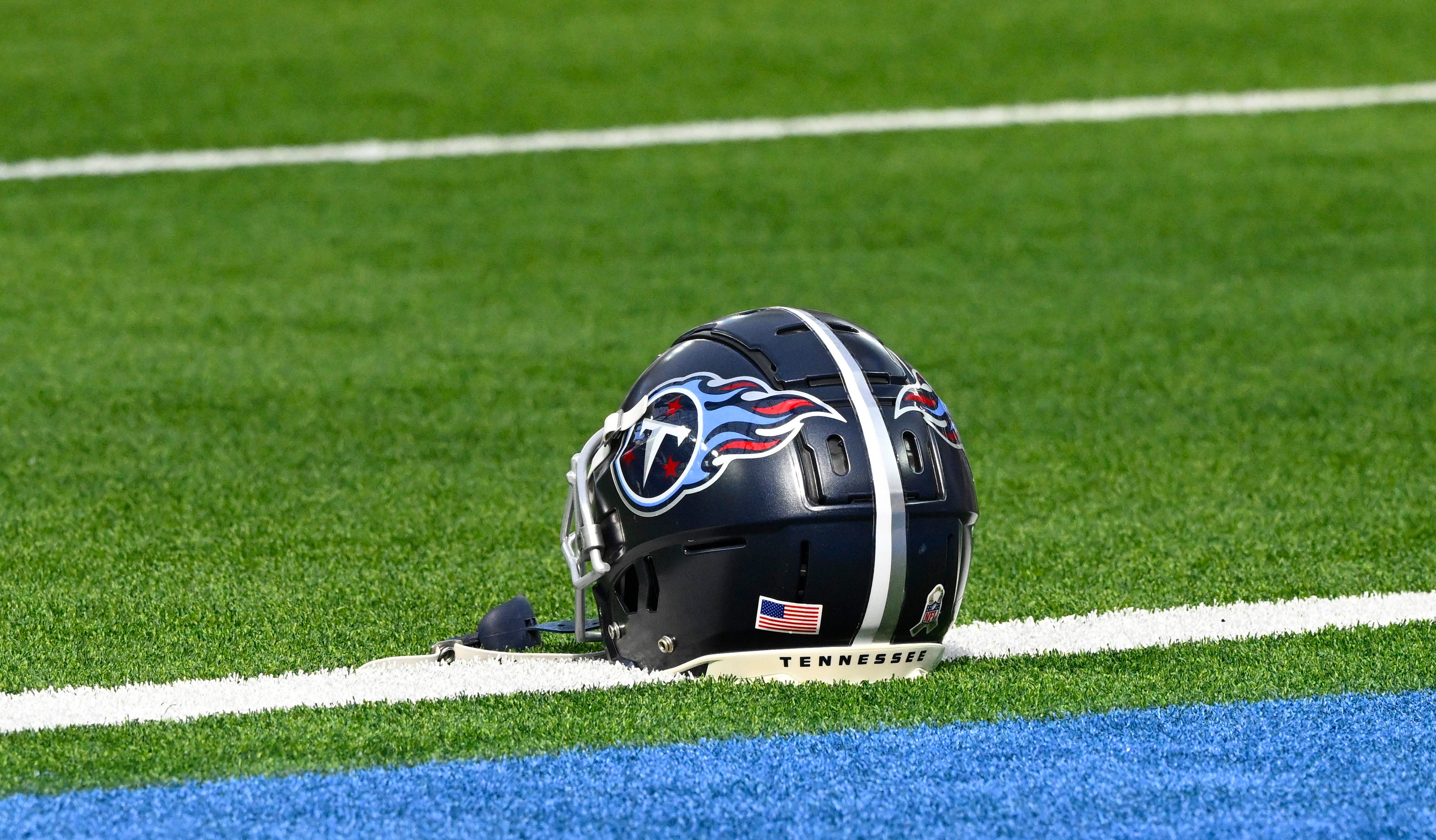 A Tennessee Titans helmet on the turf during pregame warmups before an NFL game against the Los Angeles Chargers at SoFi Stadium. Robert Hanashiro-Imagn Images