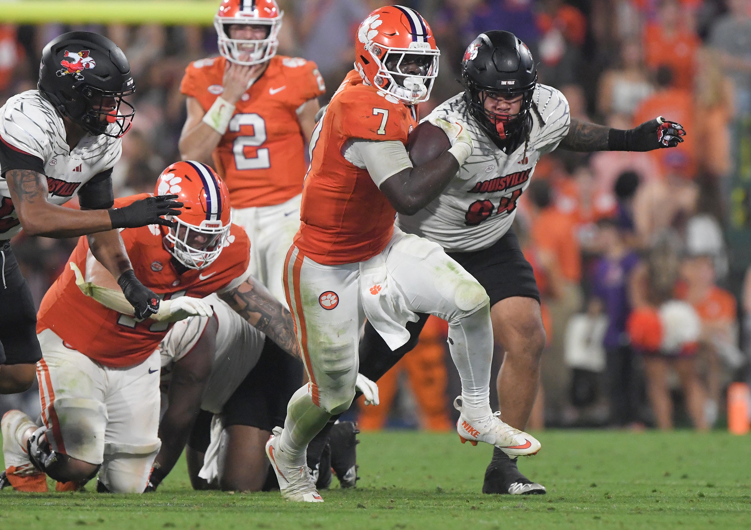 Clemson Tigers running back Phil Mafah (7) runs against the Louisville Cardinals during the fourth quarter at Memorial Stadium.