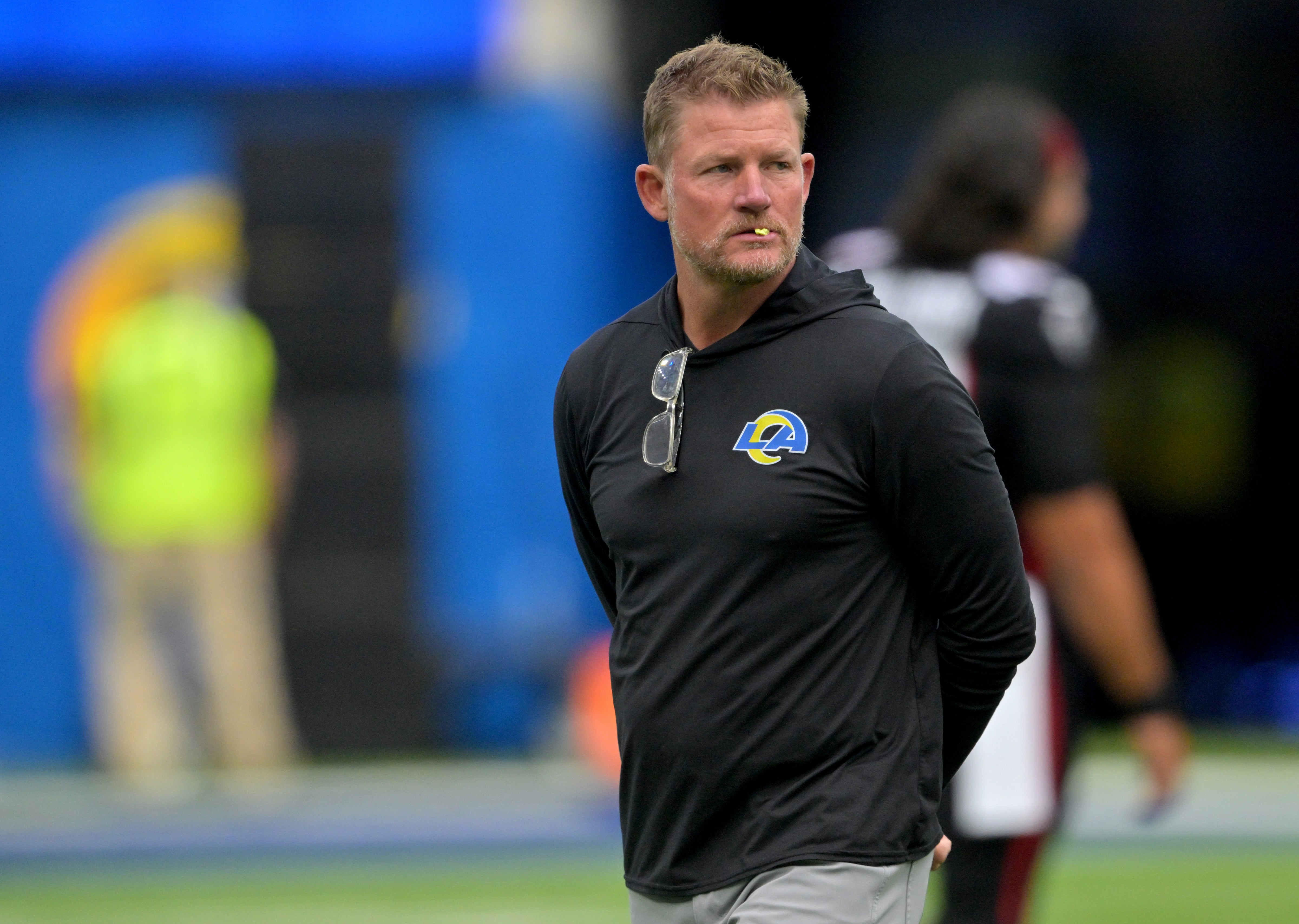 Los Angeles Rams general manager Les Snead watches players warm up before the game against the Atlanta Falcons at SoFi Stadium.