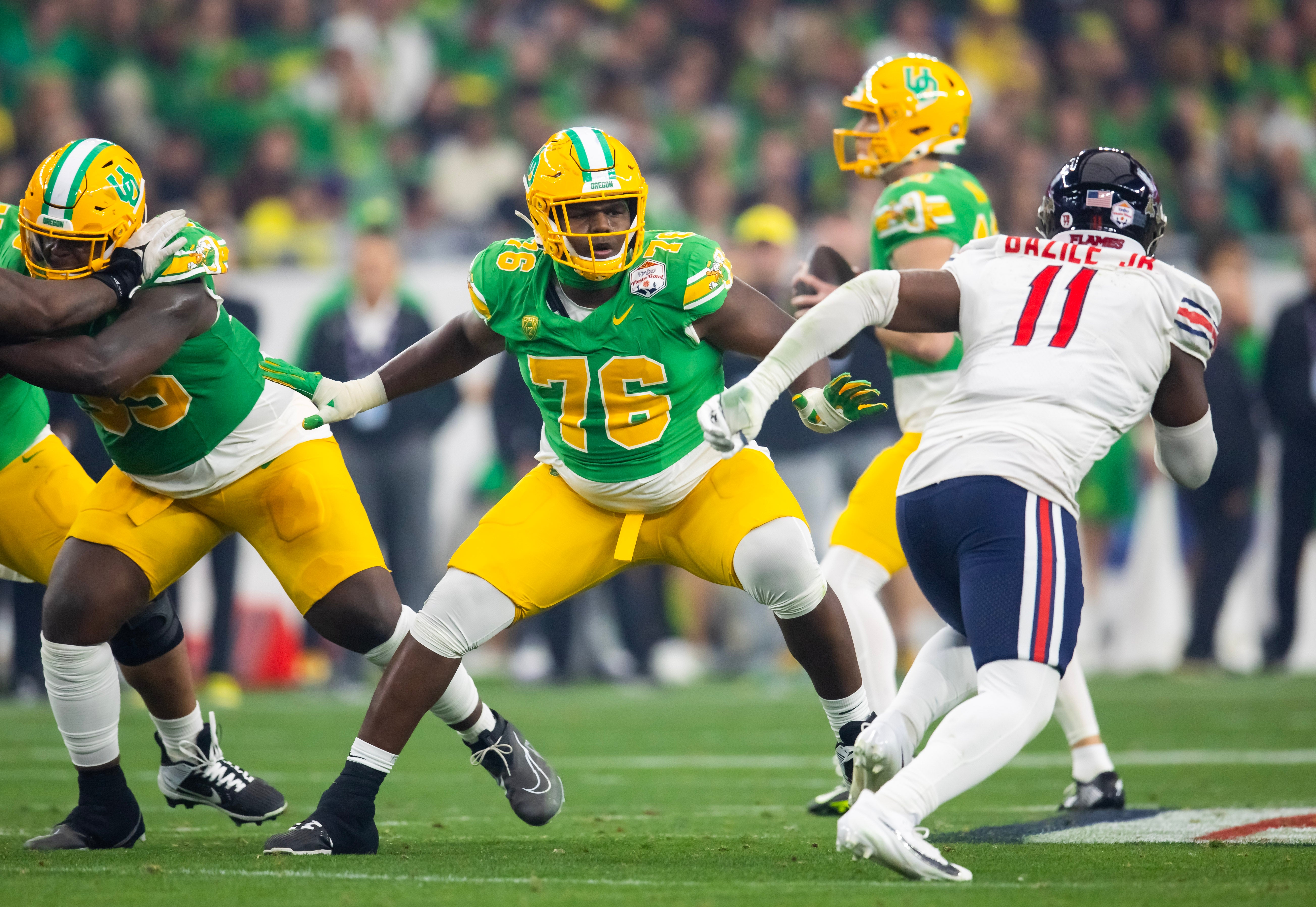 Jan 1, 2024; Glendale, AZ, USA; Oregon Ducks offensive lineman Josh Conerly Jr. (76) against the Liberty Flames during the 2024 Fiesta Bowl at State Farm Stadium.