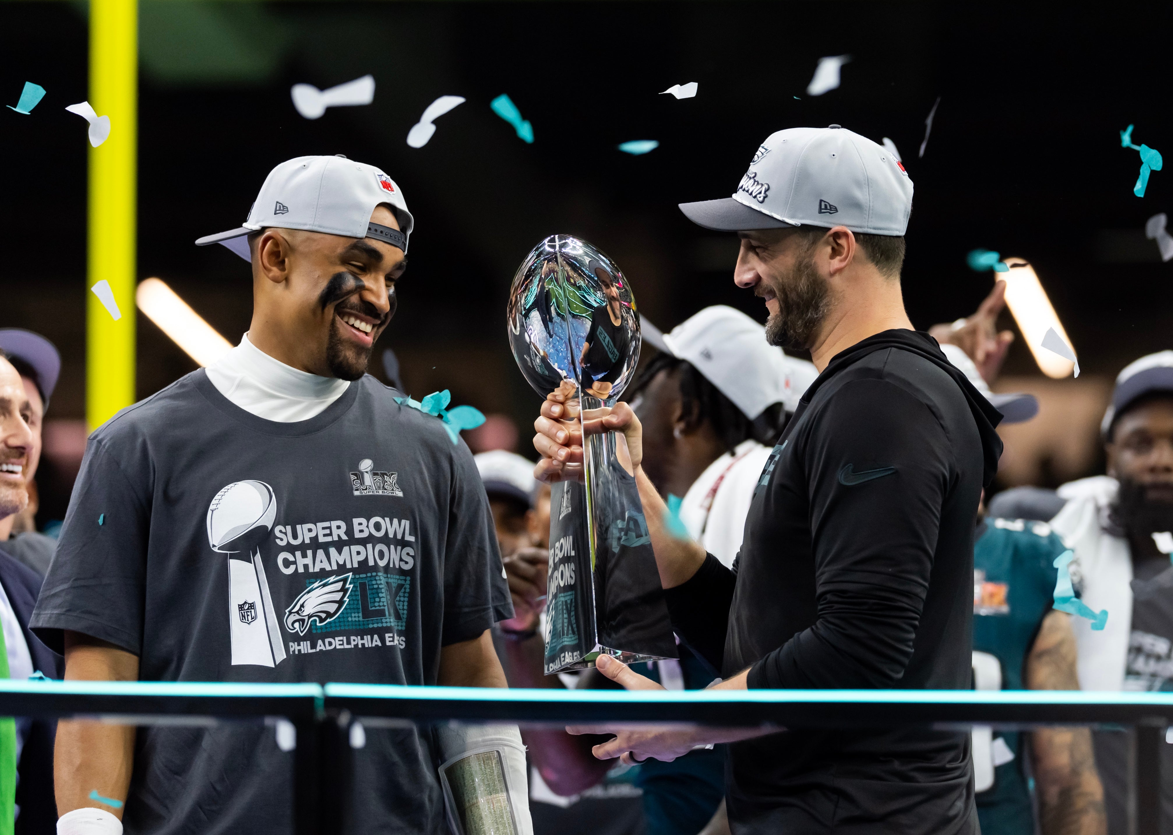 Philadelphia Eagles quarterback Jalen Hurts (left) and head coach Nick Sirianni celebrate with the Vince Lombardi Trophy after defeating the Kansas City Chiefs during Super Bowl LIX at Ceasars Superdome.