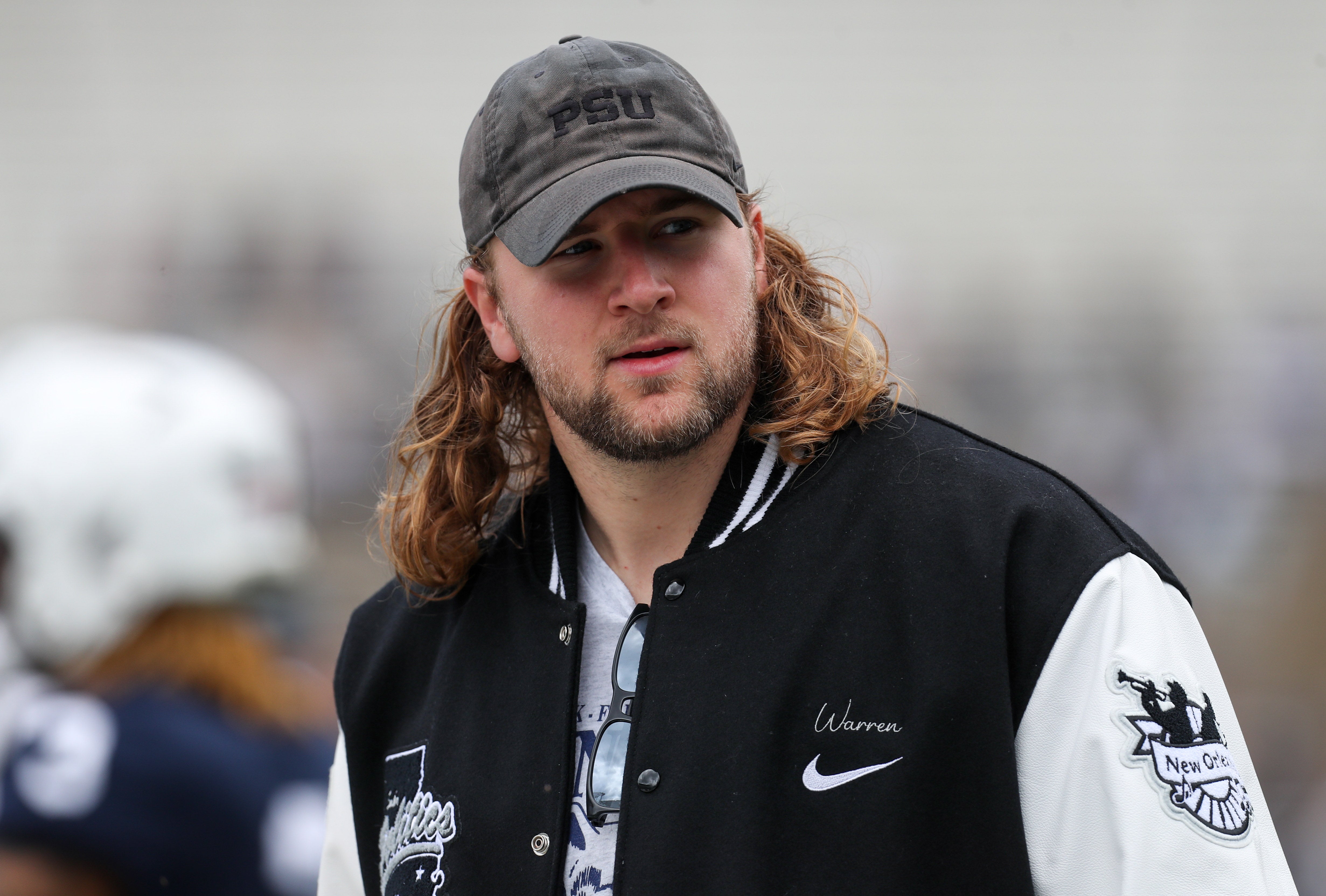 Apr 26, 2025; University Park, PA, USA; Former Penn State Nittany Lions tight end Tyler Warren walks on the sideline prior to the Blue White spring game at Beaver Stadium.