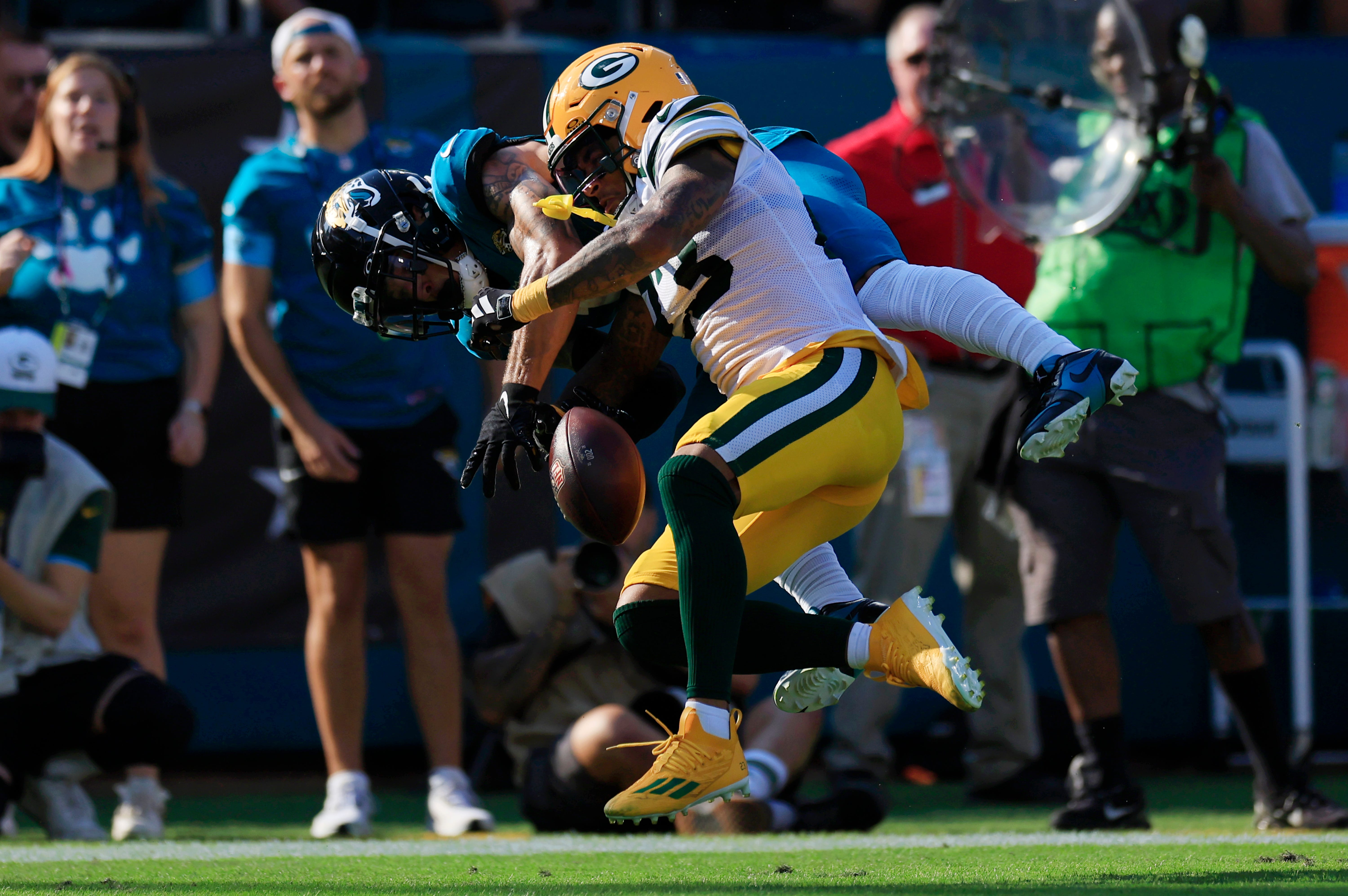 Jacksonville Jaguars wide receiver Parker Washington (11) can’t haul in a touchdown reception against Green Bay Packers cornerback Jaire Alexander (23) during the fourth quarter of an NFL football matchup Sunday, Oct. 27, 2024 at EverBank Stadium in Jacksonville, Fla. The Packers edged the Jaguars 30-27 on a last-second field goal.
