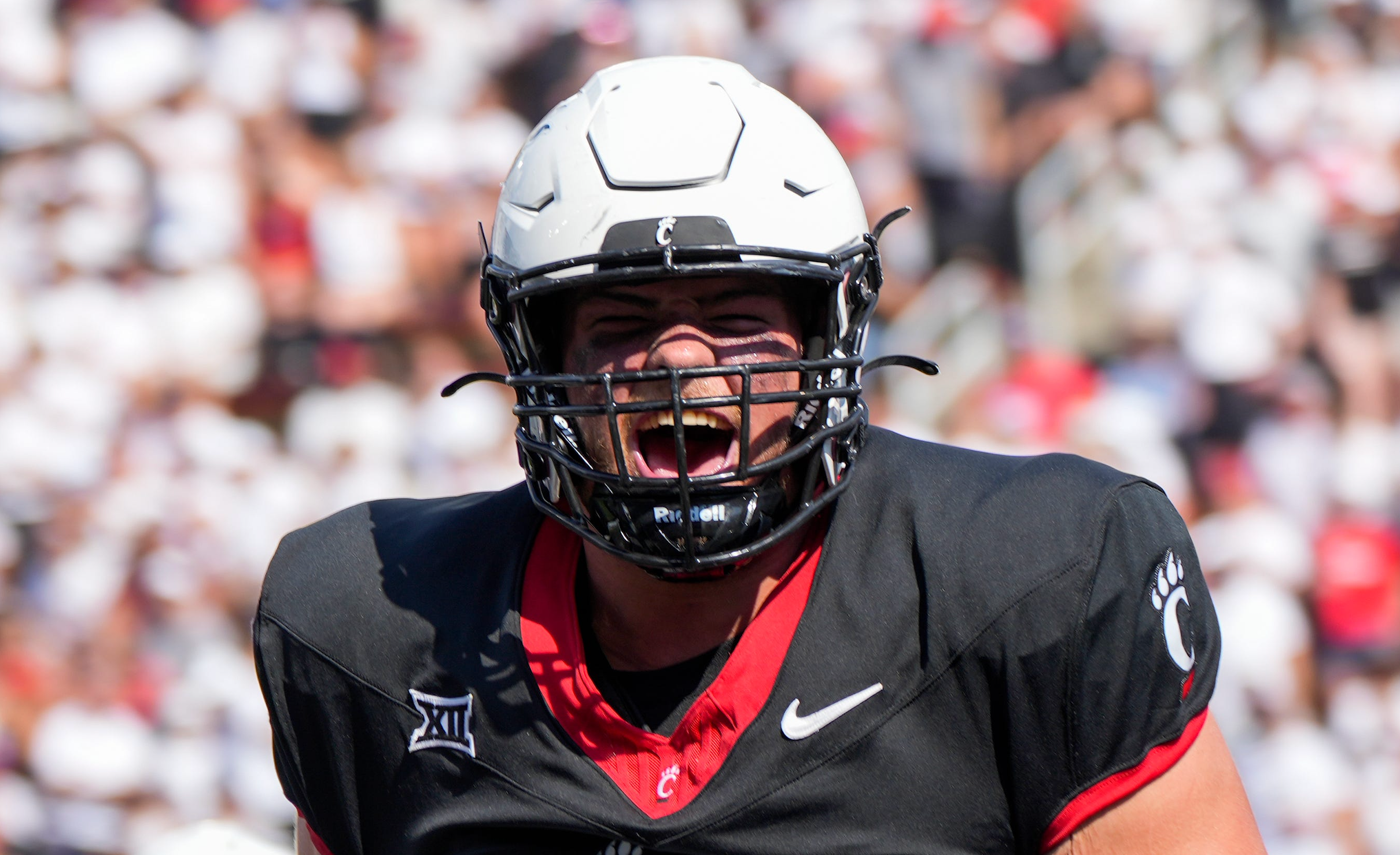 Cincinnati Bearcats offensive lineman Luke Kandra (67) celebrates after Cincinnati Bearcats tight end Payten Singletary (88) scores a touchdown during the first half of the NCAA football game between the Cincinnati Bearcats and the Eastern Kentucky Colonels at Nippert Stadium in Cincinnati on Saturday, Sept. 2, 2023.
