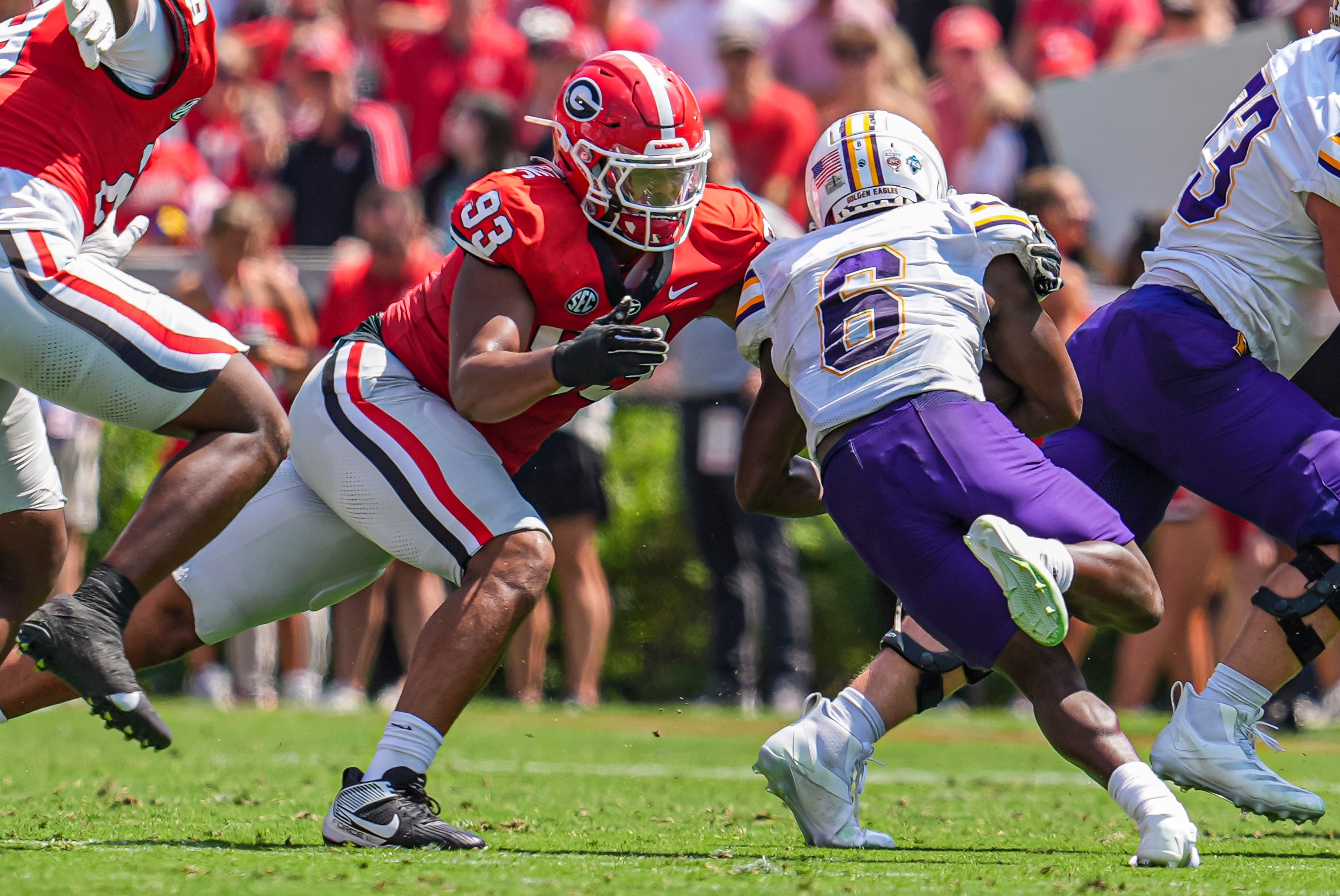 Sep 7, 2024; Athens, Georgia, USA; Georgia Bulldogs defensive lineman Tyrion Ingram-Dawkins (93) tackles Tennessee Tech Golden Eagles wide receiver D'Arious Reed (6) during the first half at Sanford Stadium.