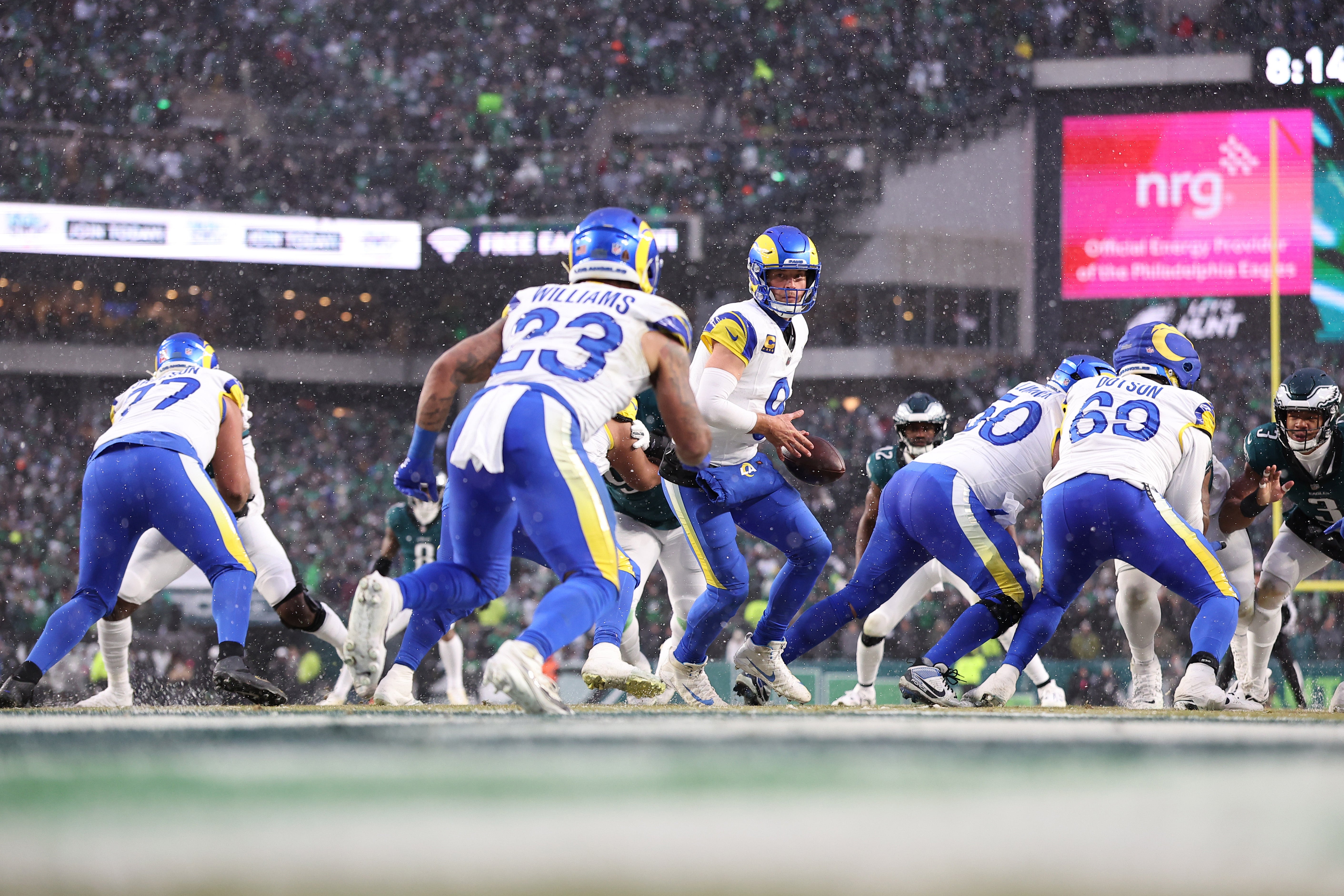 Jan 19, 2025; Philadelphia, Pennsylvania, USA; Los Angeles Rams quarterback Matthew Stafford (9) prepares to hand the ball to Los Angeles Rams running back Kyren Williams (23) against the Philadelphia Eagles during the first half in a 2025 NFC divisional round game at Lincoln Financial Field.