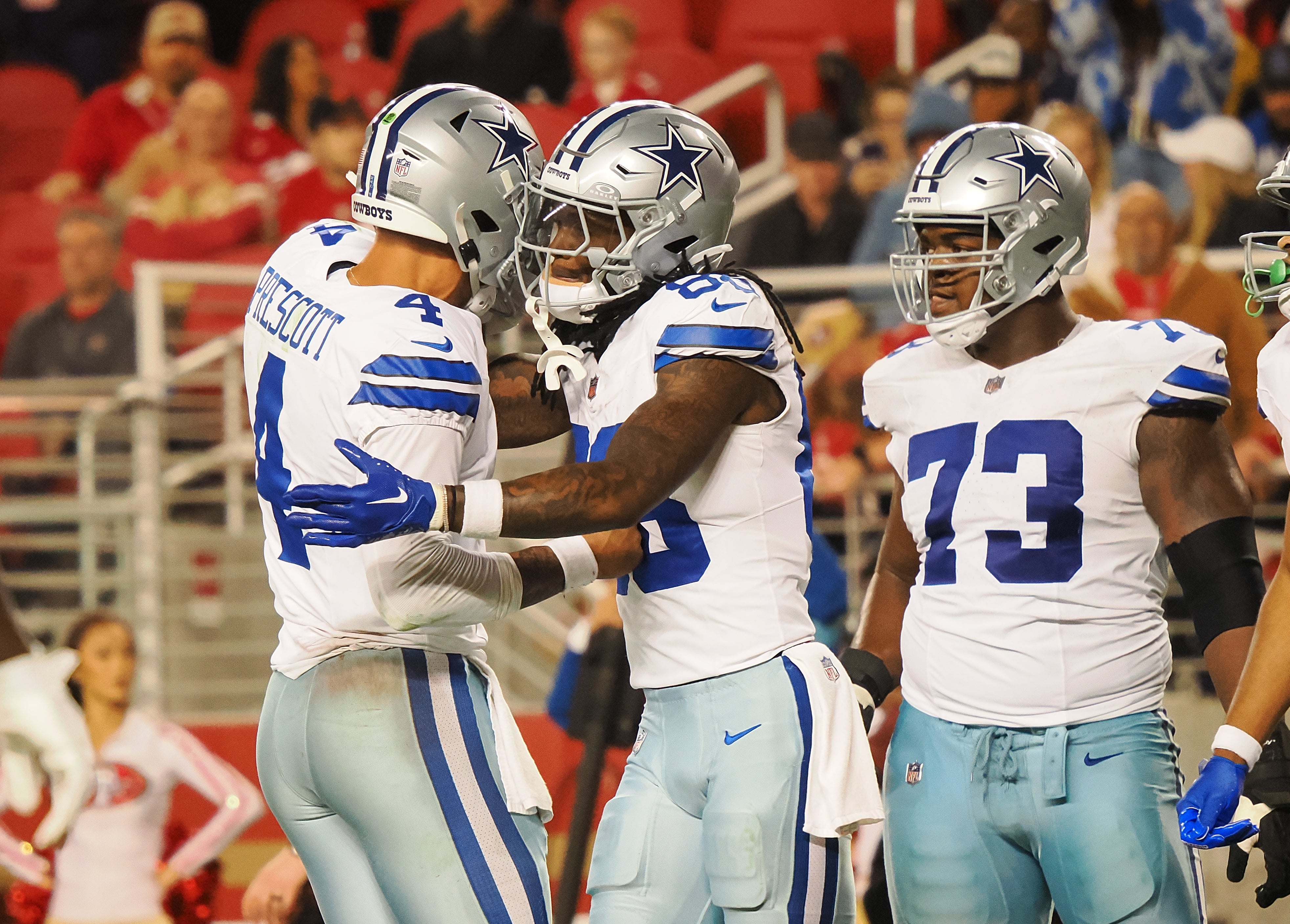Dallas Cowboys quarterback Dak Prescott (4) celebrates with wide receiver CeeDee Lamb (88) after a touchdown against the San Francisco 49ers during the fourth quarter at Levi's Stadium.