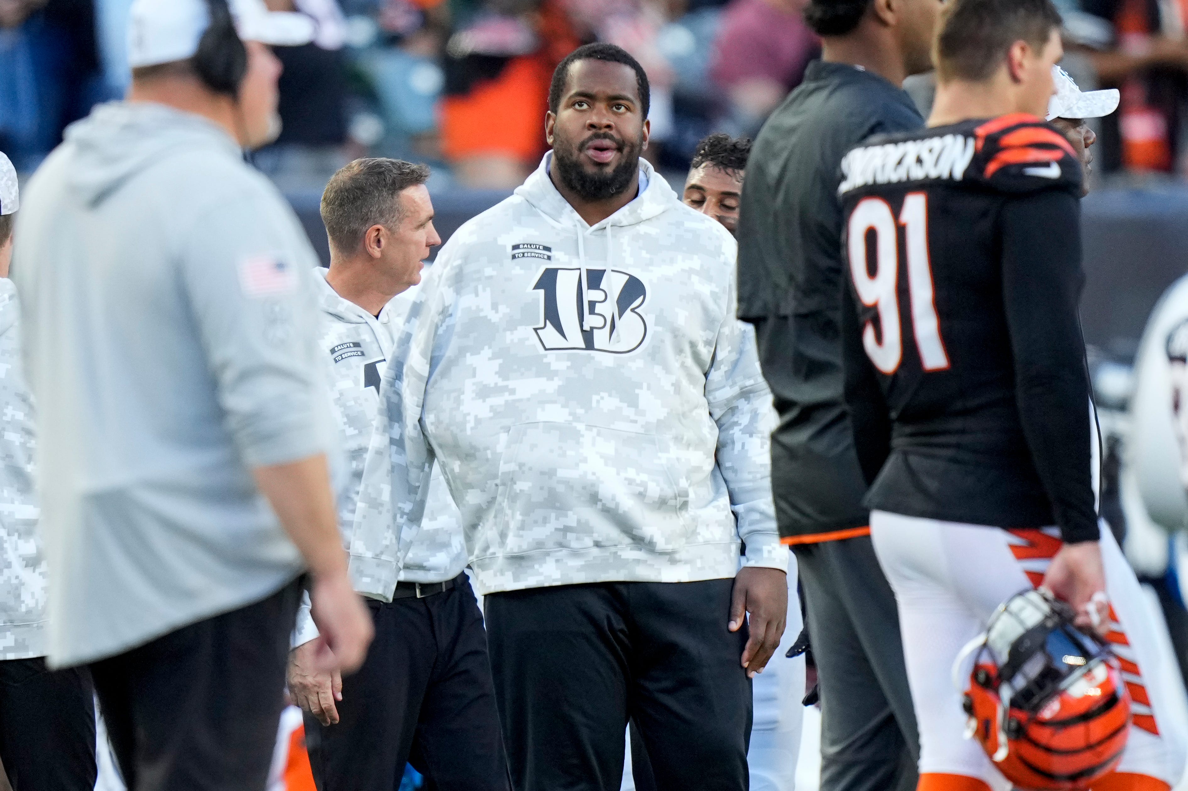 Injured Cincinnati Bengals defensive tackle B.J. Hill (92) stands on the sideline in the fourth quarter of the NFL Week 9 game between the Cincinnati Bengals and the Las Vegas Raiders at Paycor Stadium in downtown Cincinnati on Sunday, Nov. 3, 2024. The Bengals collected their first win at home with a 41-24 victory over the Raiders.  