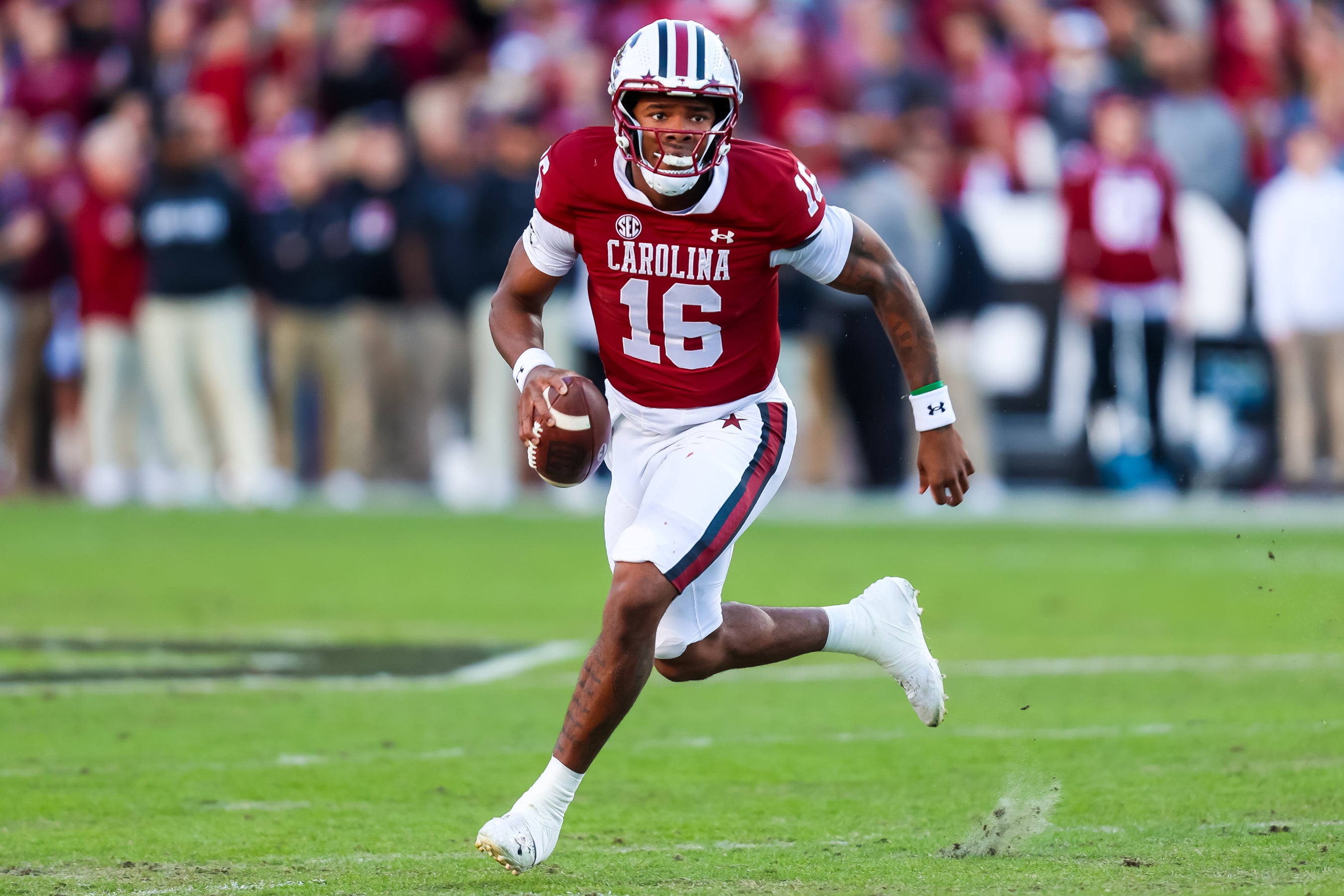 Nov 23, 2024; Columbia, South Carolina, USA; South Carolina Gamecocks quarterback LaNorris Sellers (16) scrambles against the Wofford Terriers in the first quarter at Williams-Brice Stadium. Mandatory Credit: Jeff Blake-Imagn Images