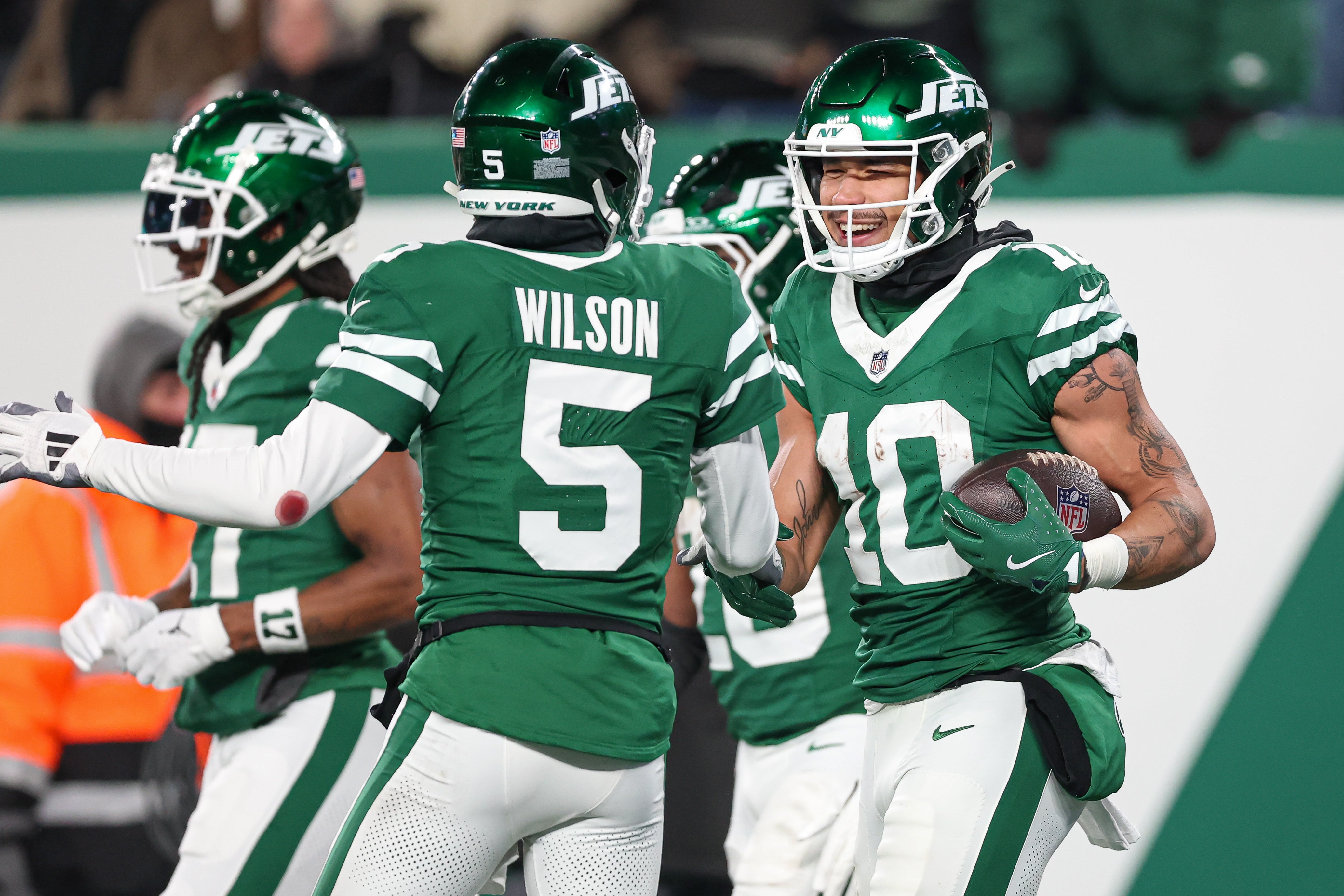 New York Jets wide receiver Allen Lazard (10) celebrates his touchdown reception with wide receiver Garrett Wilson (5) during the first half against the Miami Dolphins at MetLife Stadium.