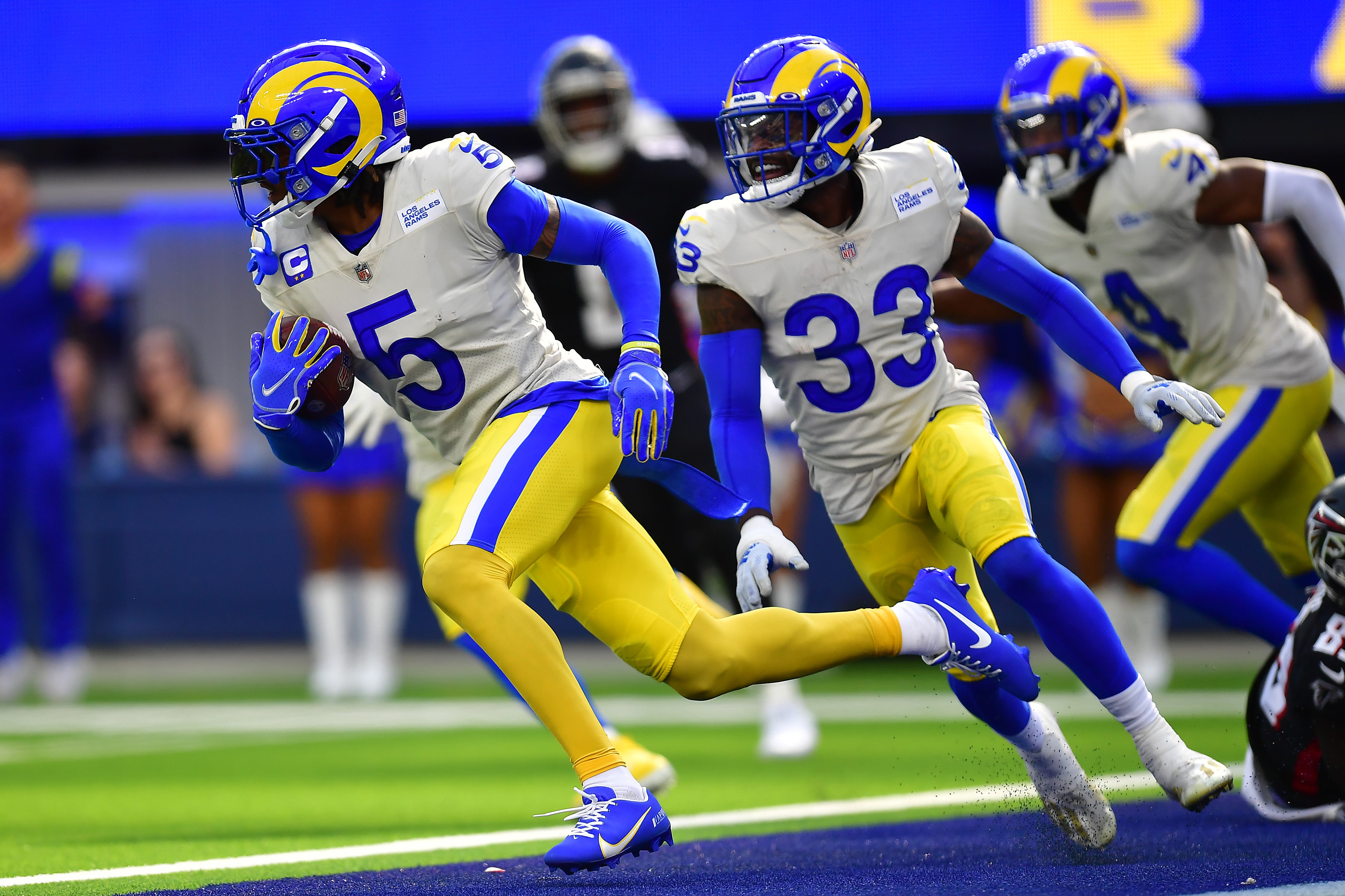 Sep 18, 2022; Inglewood, California, USA; Los Angeles Rams cornerback Jalen Ramsey (5) runs the ball after intercepting a pass intended for Atlanta Falcons wide receiver Bryan Edwards (89) during the second half at SoFi Stadium.