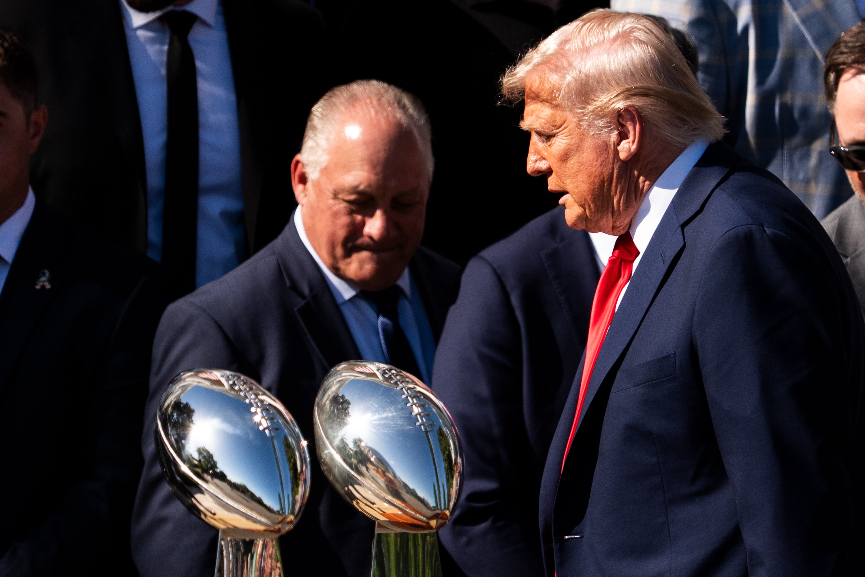 Apr 28, 2025; Washington, D.C., USA; President Donald Trump walks past two Vince Lombardi trophies after an event at the White House celebrating the Philadelphia Eagles and their recent Super Bowl victory Monday, April 28, 2025.