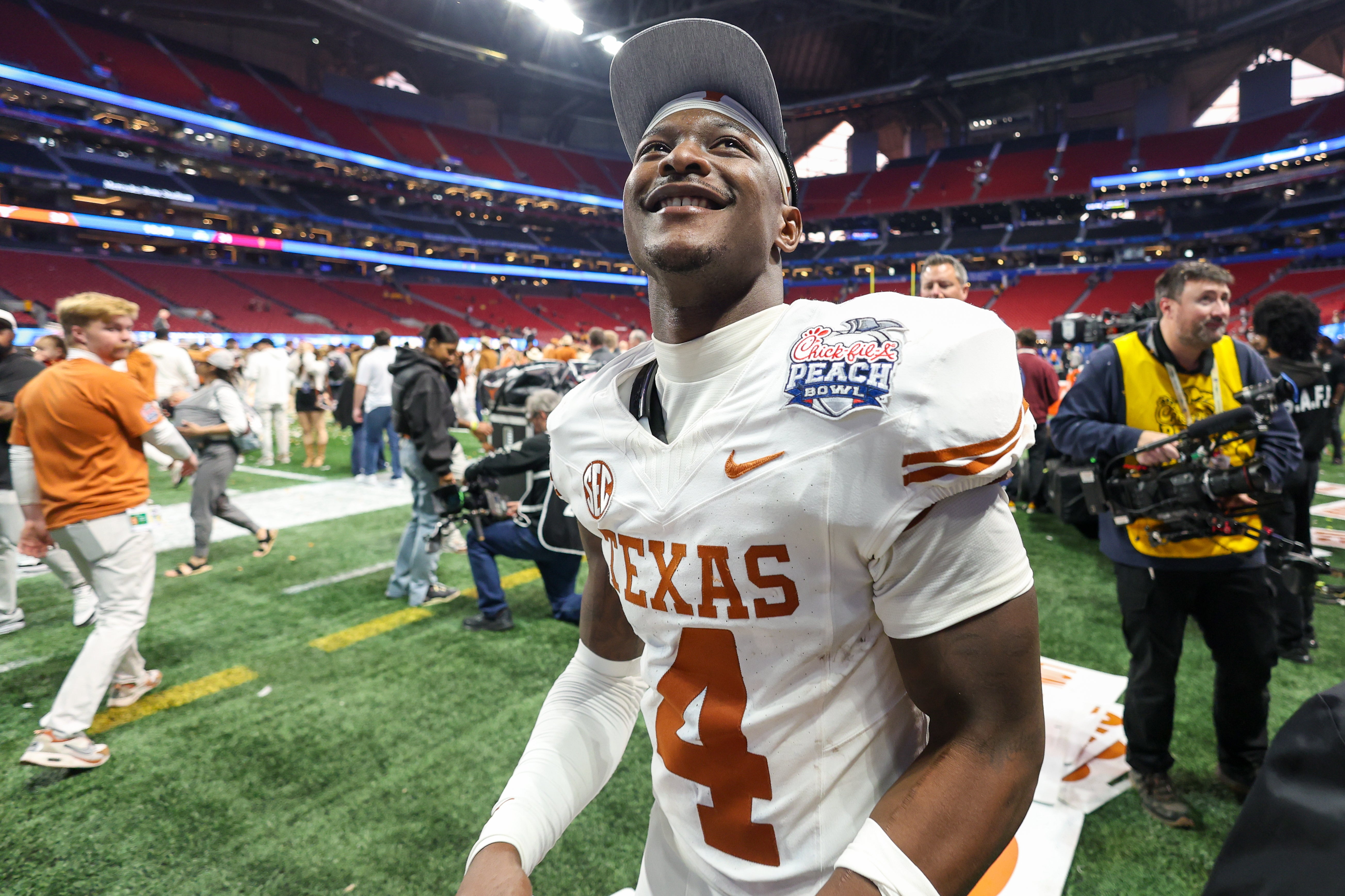 Texas Longhorns defensive back Andrew Mukuba (4) celebrates after a victory over the Arizona State Sun Devils in the Peach Bowl at Mercedes-Benz Stadium.