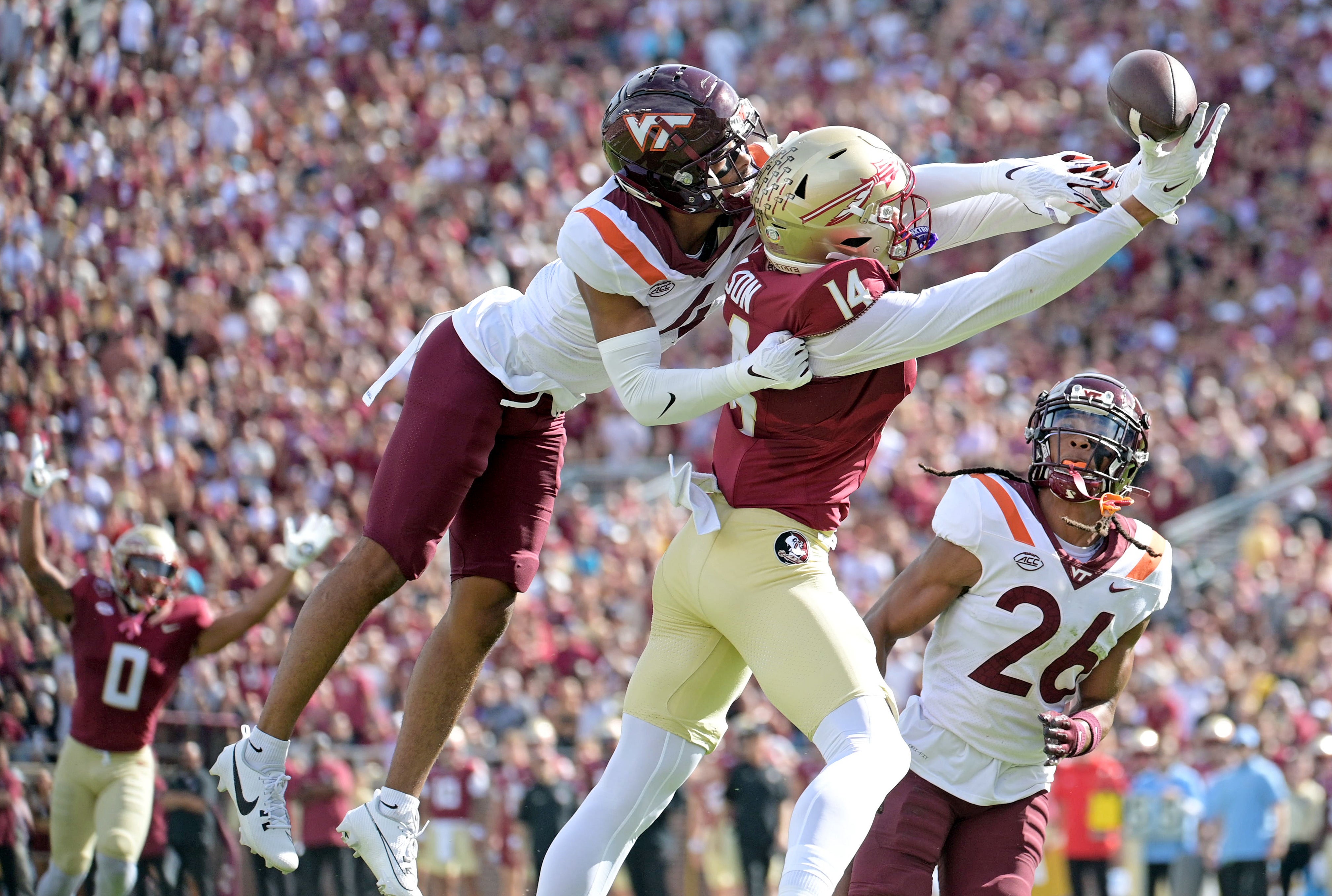 Florida State Seminoles wide receiver Keon Coleman (4) fails to secure a catch as Virginia Tech Hokies cornerback Mansoor Delane (4) defends during the first half at Doak S. Campbell Stadium.