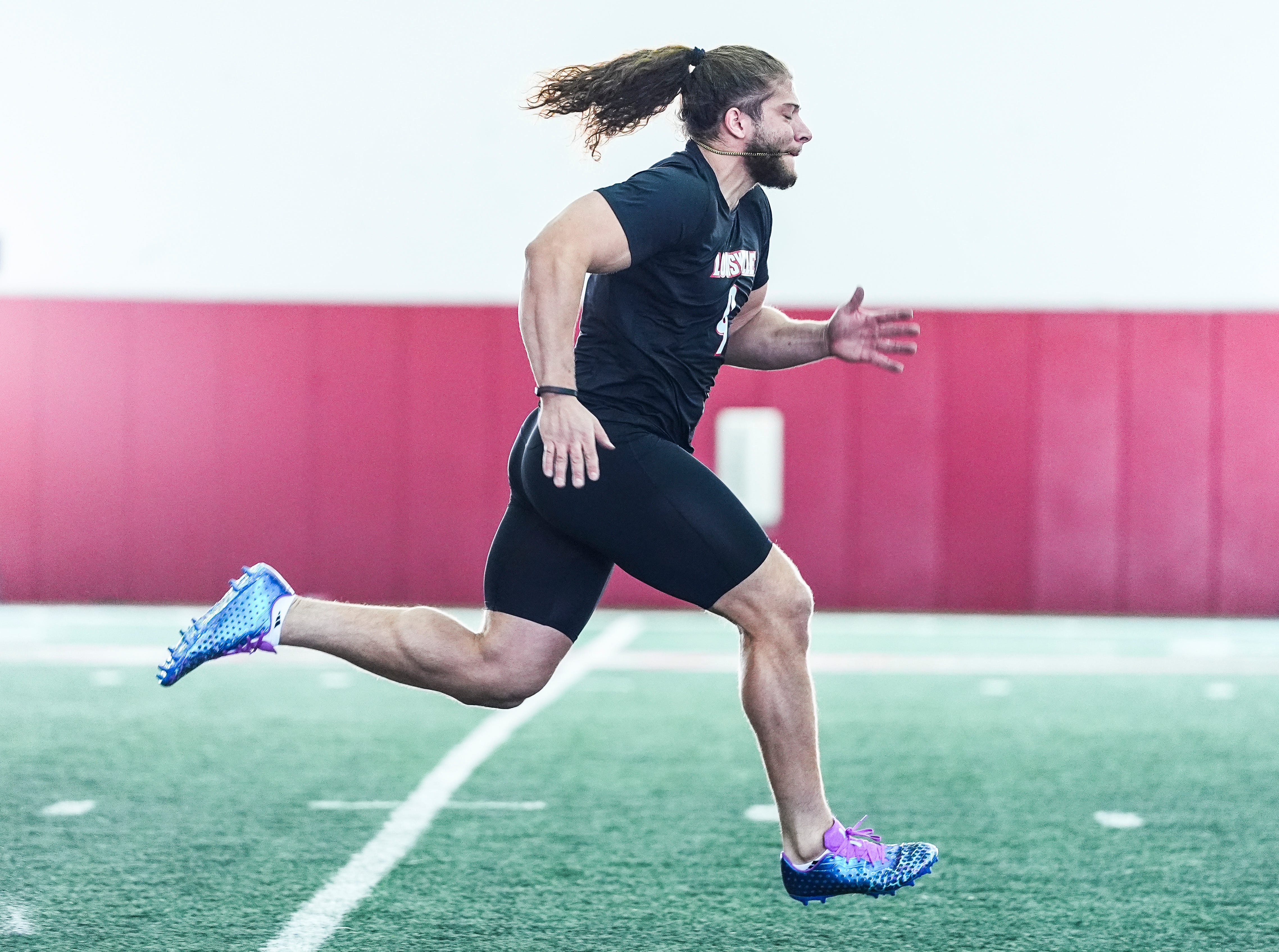 Louisville defensive end Ashton Gillotte runs a 40 yard dash during Pro Day at the UofL Football's Trager Indoor Practice Facility Tuesday, March 25, 2025.