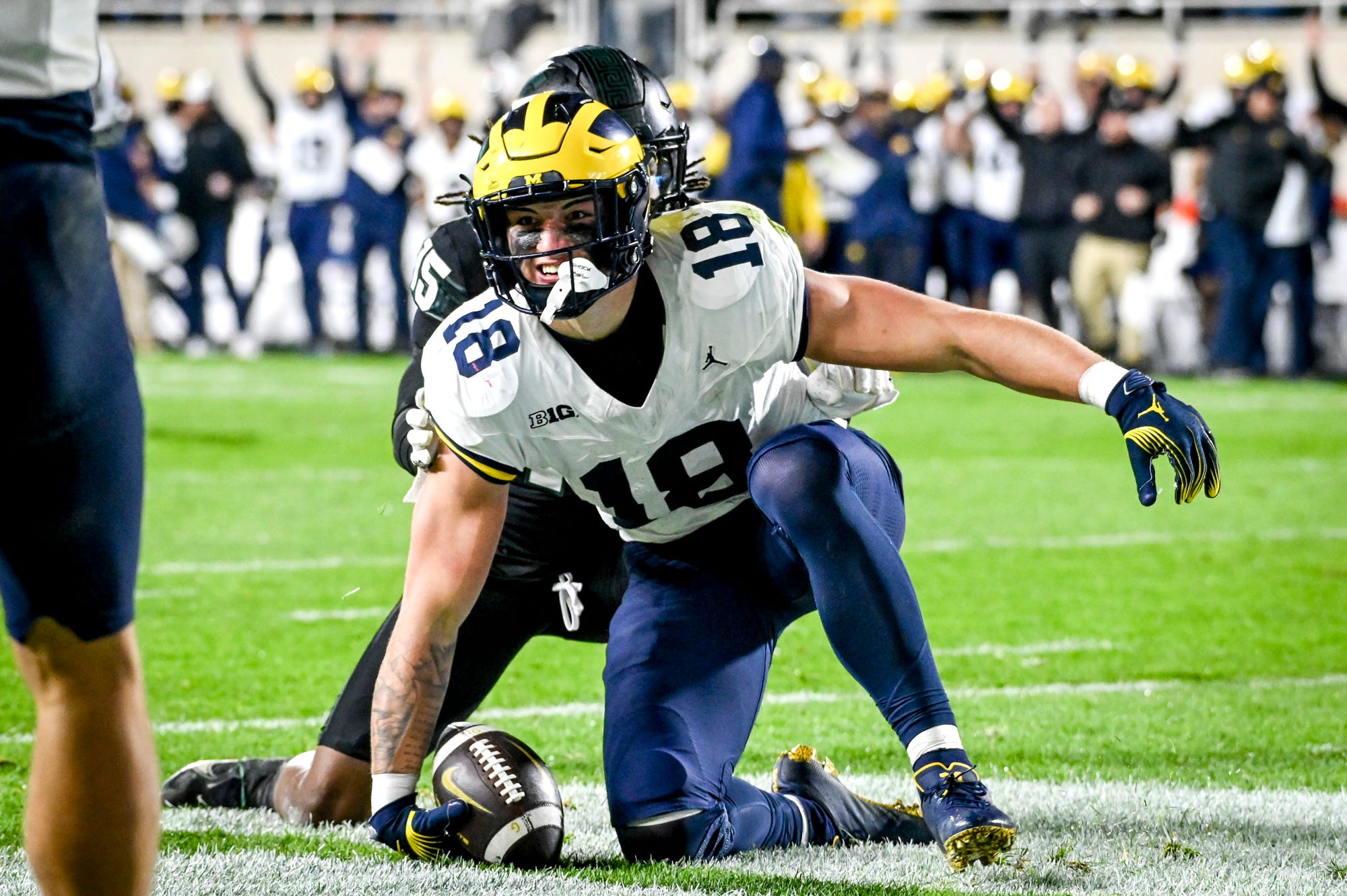 Michigan's Colston Loveland celebrates his touchdown against Michigan State during the second quarter on Saturday, Oct. 21, 2023, at Spartan Stadium in East Lansing.  