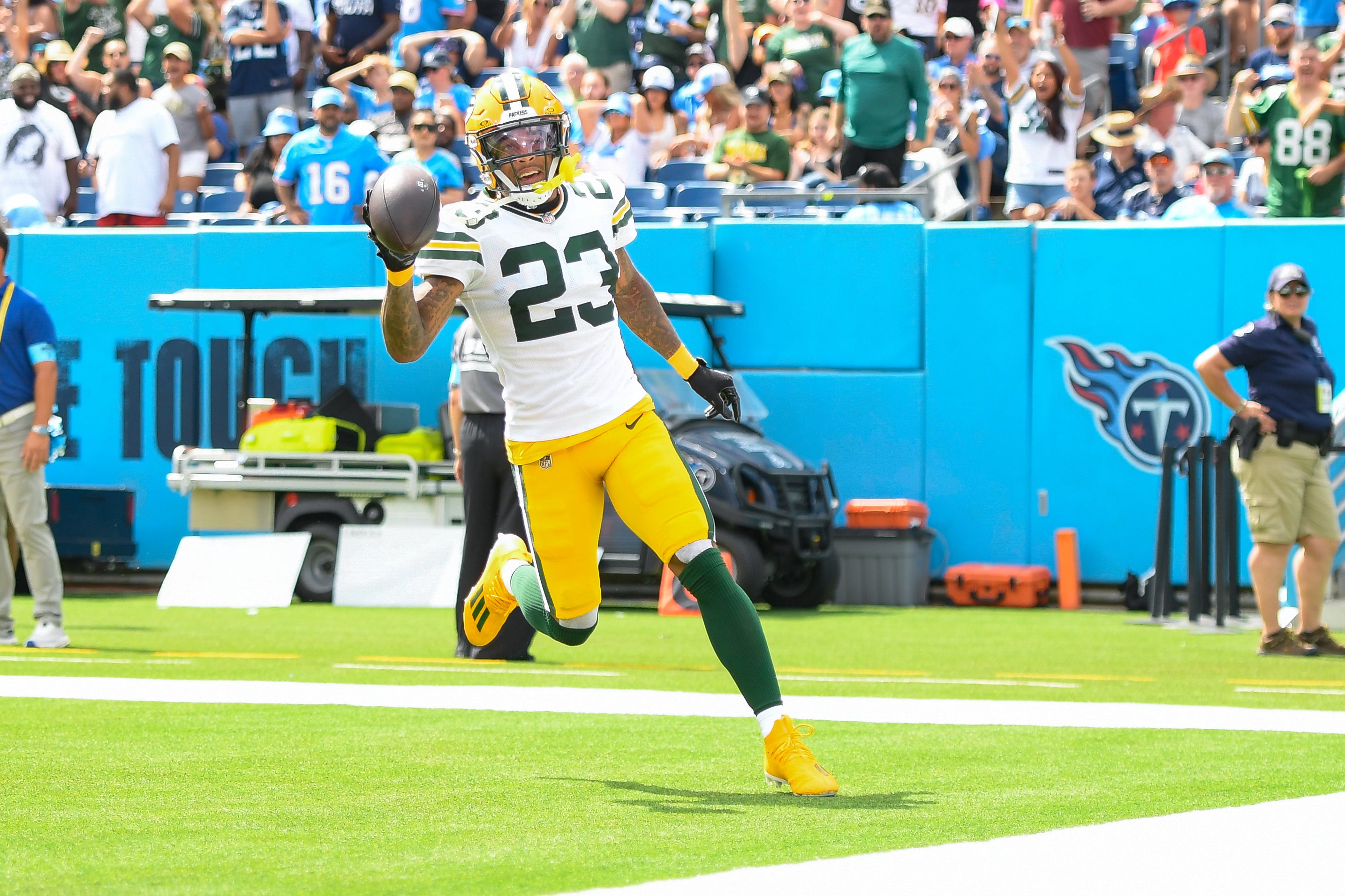 Green Bay Packers cornerback Jaire Alexander (23) scores on a pick six thrown by Tennessee Titans Will Levis (8) during the first half at Nissan Stadium.