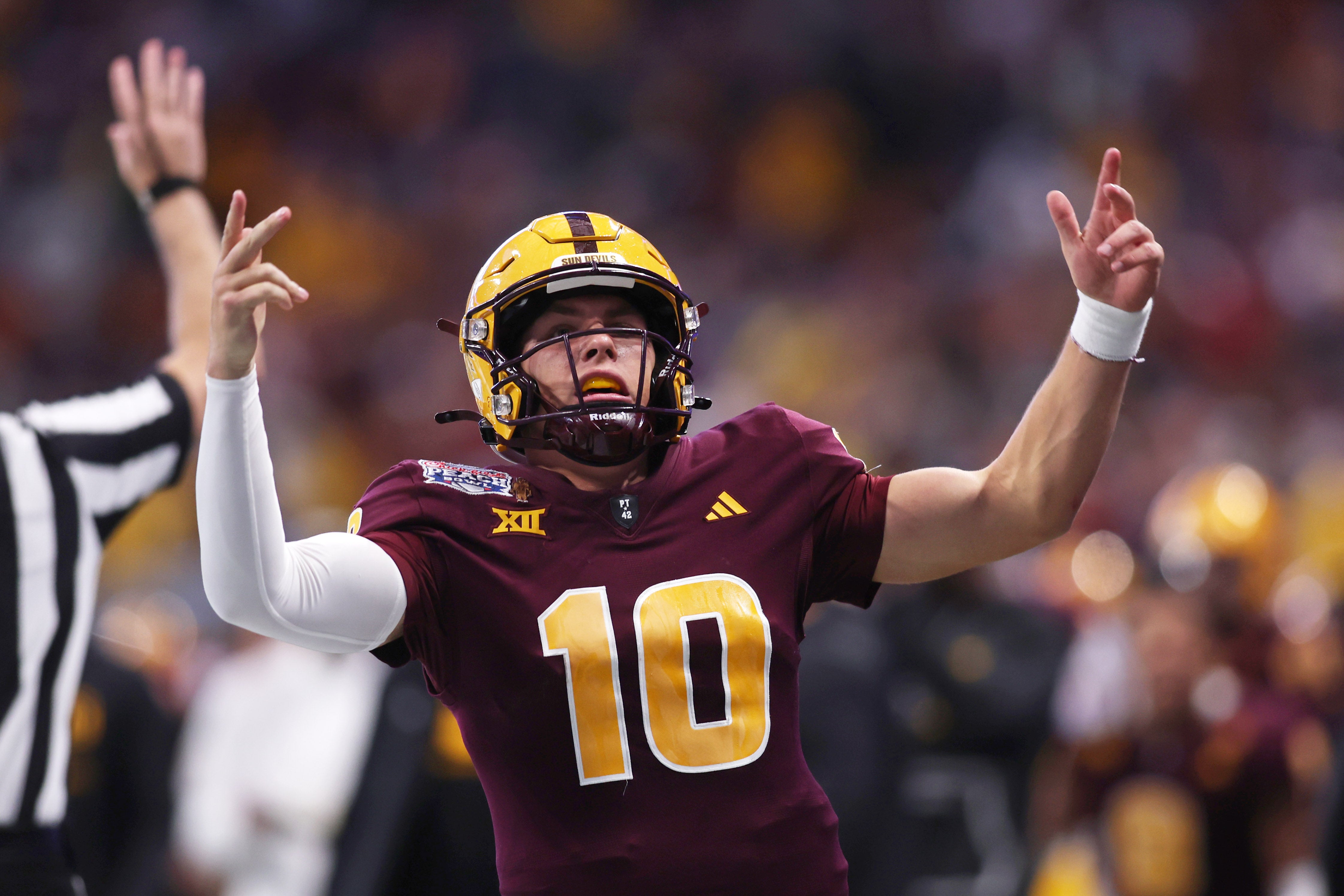 Jan 1, 2025; Atlanta, GA, USA; Arizona State Sun Devils quarterback Sam Leavitt (10) reacts after a play against the Texas Longhorns during the second half of the Peach Bowl at Mercedes-Benz Stadium.