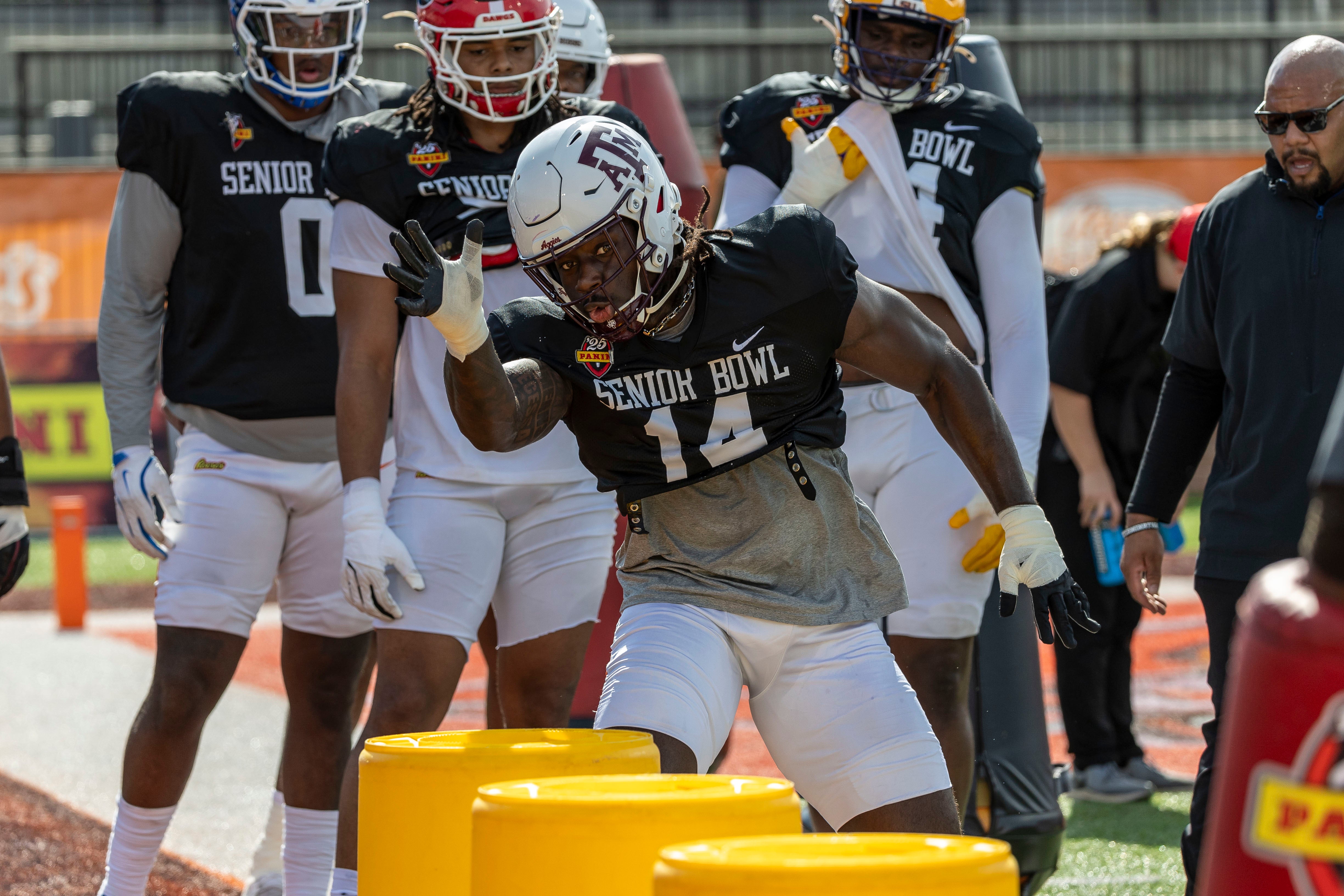 Jan 29, 2025; Mobile, AL, USA; American team defensive lineman Shemar Stewart of Texas A&M (14) works through drills during Senior Bowl practice at Hancock Whitney Stadium.