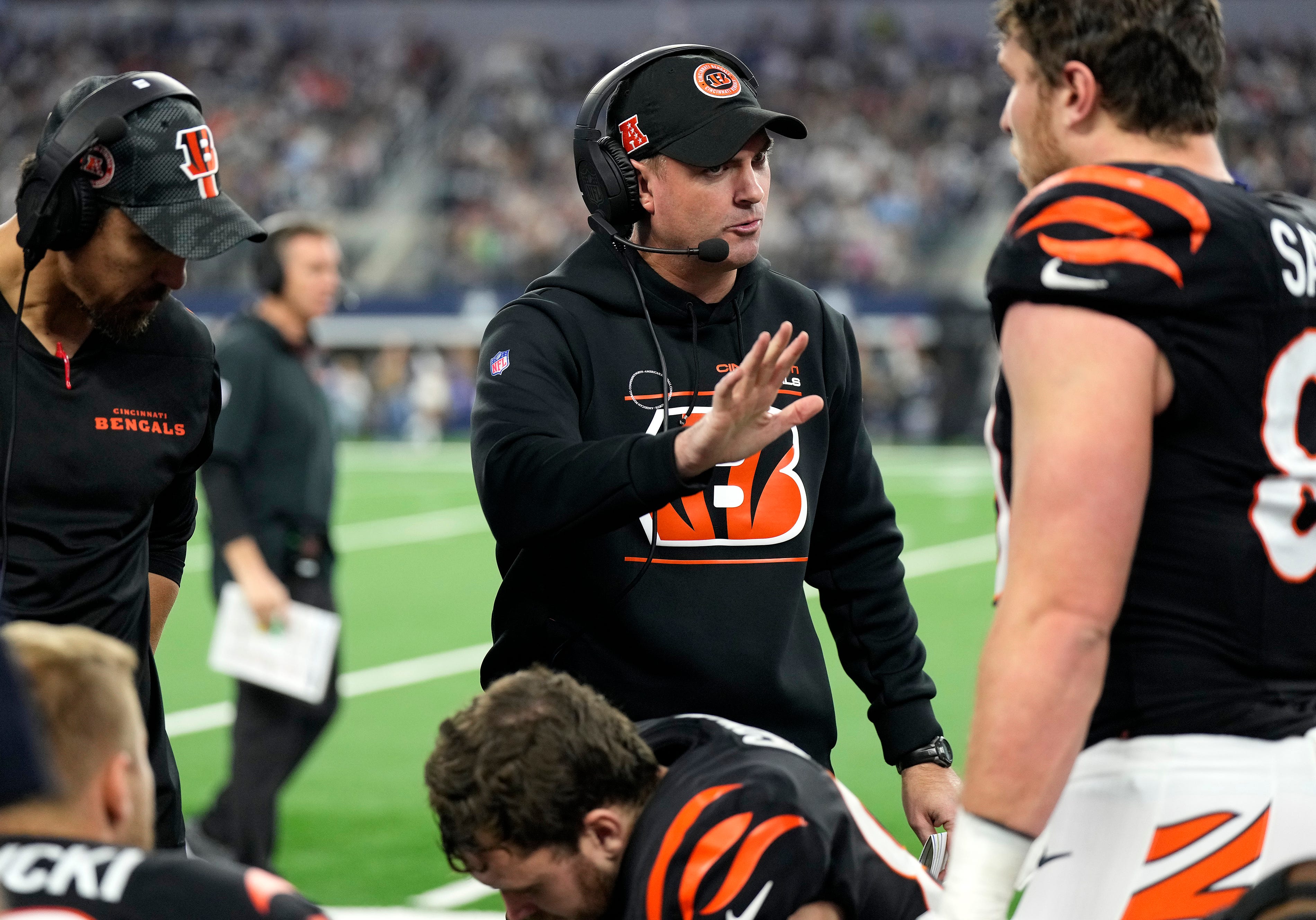 Cincinnati Bengals head coach Zac Taylor talks with tight end Drew Sample (89) as they take on Dallas Cowboys Monday Night Football at AT&T Stadium in Arlington,Texas on Monday, December 9, 2024.