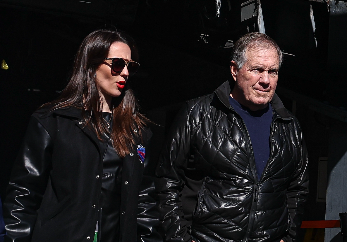 Oct 26, 2024; East Rutherford, New Jersey, USA; Former New England Patriots head coach Bill Belichick and girlfriend Jordon Hudson enter the field before the game between the Notre Dame Fighting Irish and the Navy Midshipmen at MetLife Stadium.
