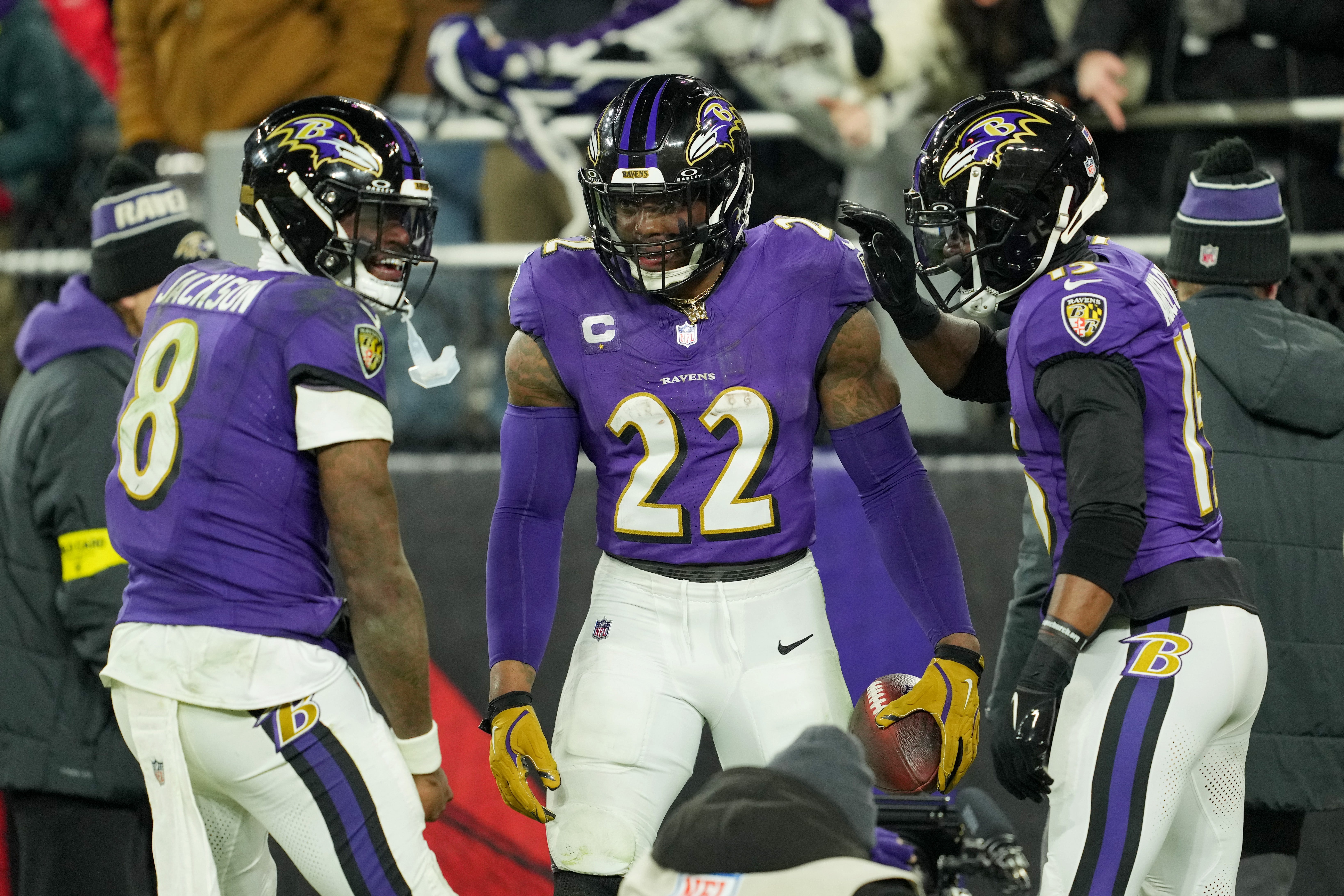 Baltimore Ravens running back Derrick Henry (22) celebrates with wide receiver Nelson Agholor (15) and quarterback Lamar Jackson (8) after scoring a touchdown against the Pittsburgh Steelers