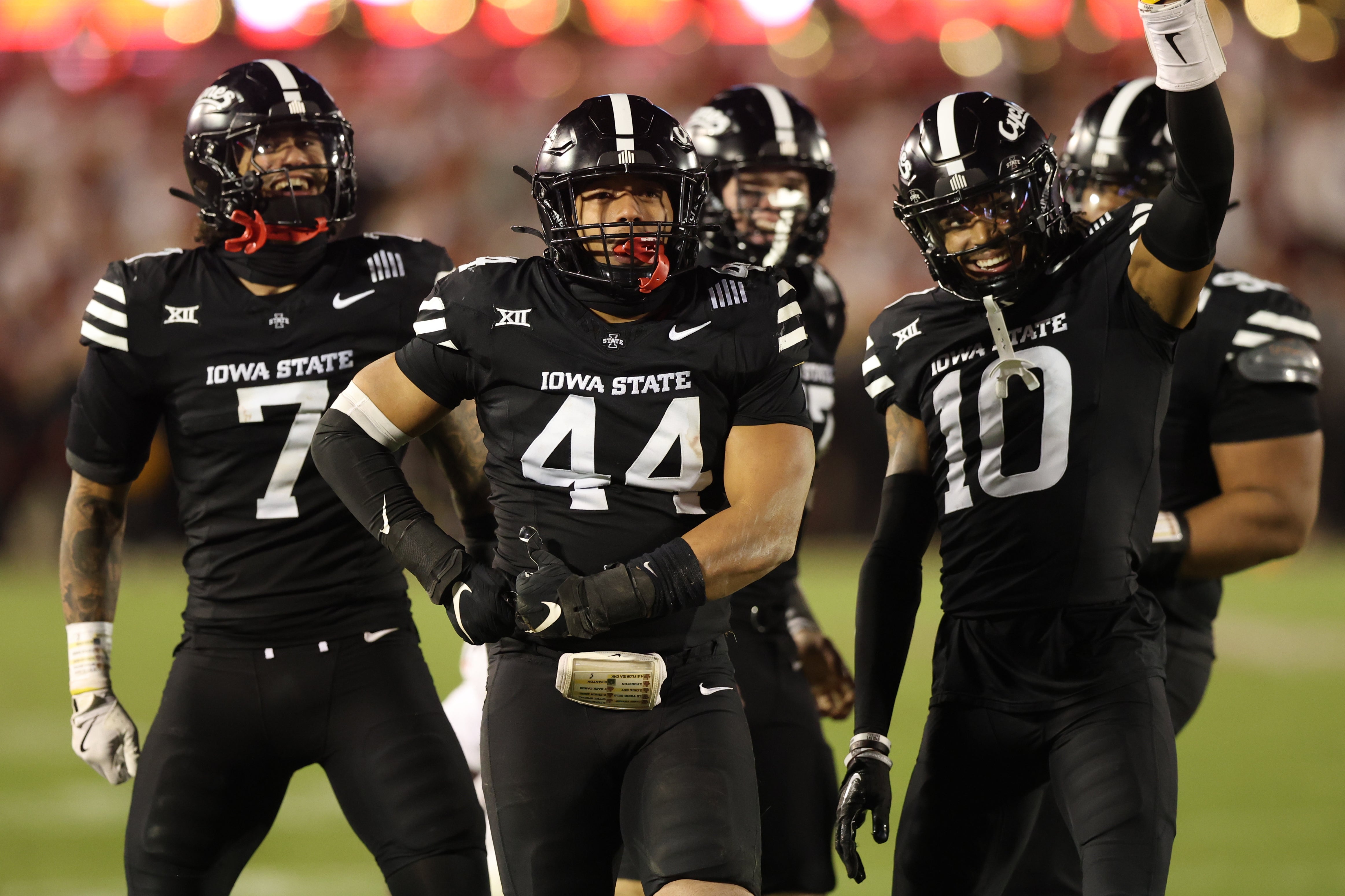 Nov 16, 2024; Ames, Iowa, USA; Iowa State Cyclones linebacker Jacob Ellis (44), defensive back Darien Porter (10) and defensive back Malik Verdon (7) celebrate during their game with the Cincinnati Bearcats at Jack Trice Stadium. The Iowa State Cyclones won the game 34-17. Mandatory Credit: Reese Strickland-Imagn Images