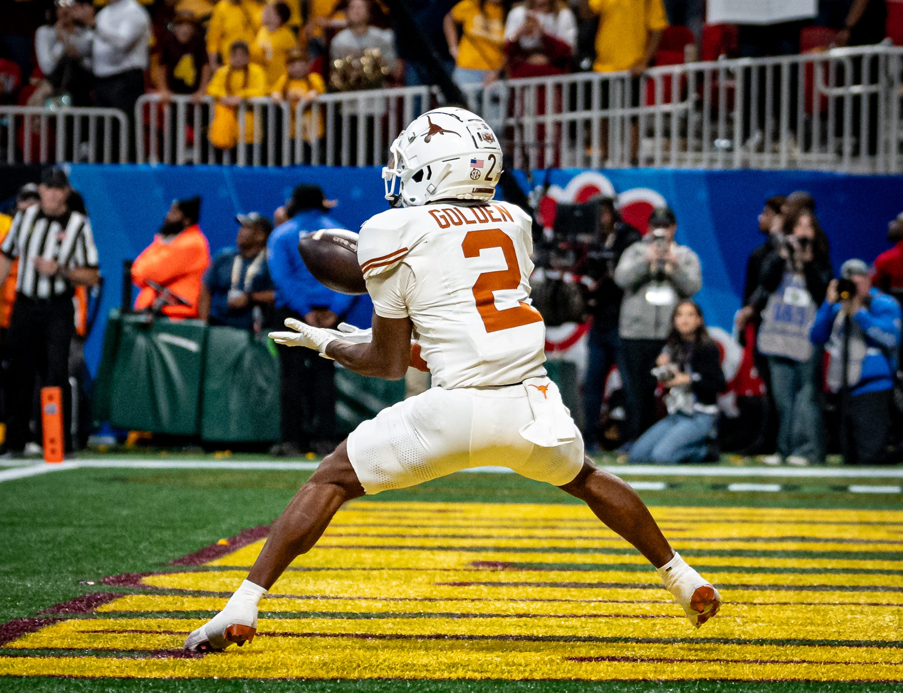 Texas Longhorns wide receiver Matthew Golden (2) catches a pass in the end zone to score during the first overtime period as the Texas Longhorns play the Arizona State Sun Devils in the Peach Bowl College Football Playoff quarterfinal at Mercedes-Benz Stadium in Atlanta, Georgia, Jan. 1, 2025.