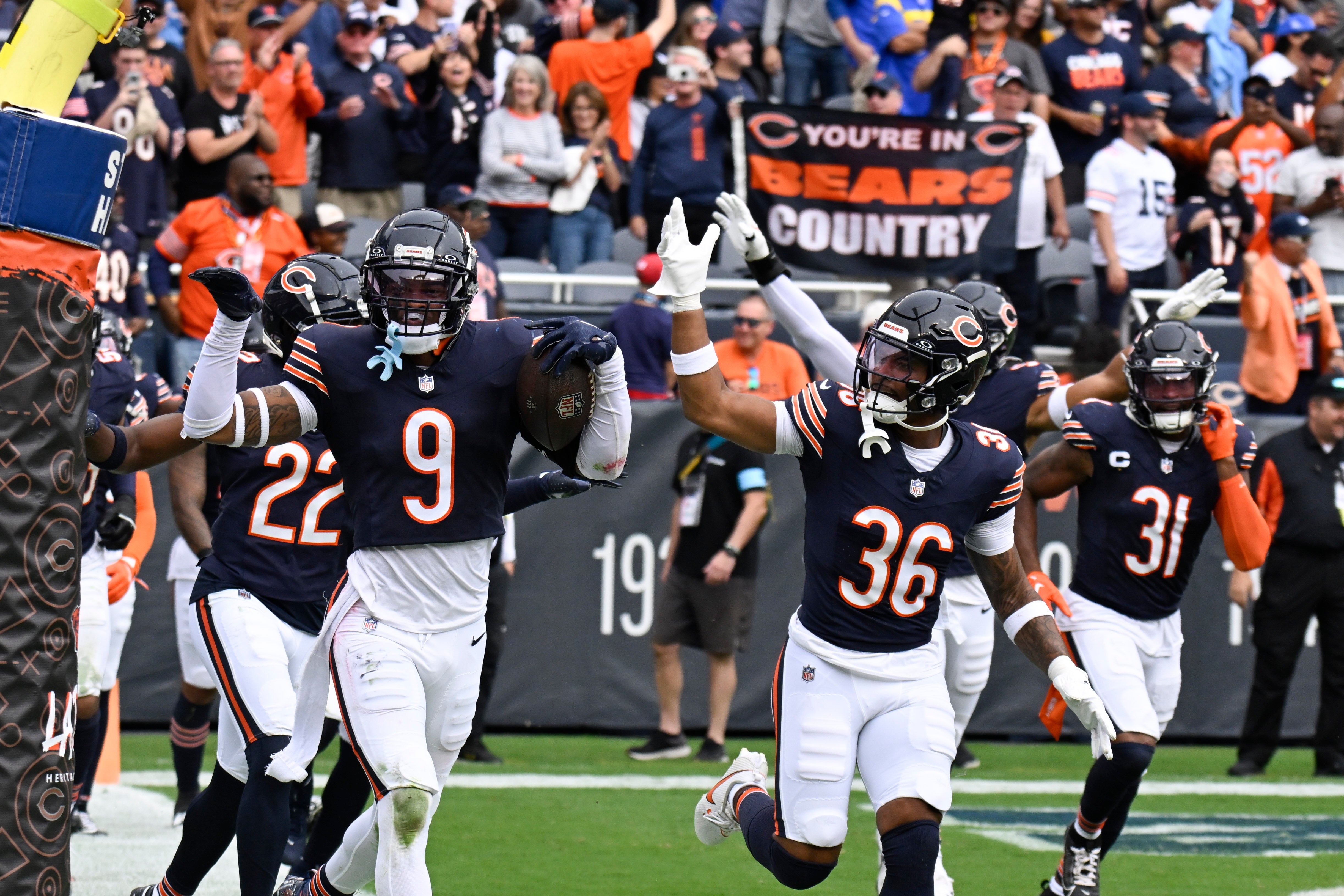 Sep 29, 2024; Chicago, Illinois, USA; Chicago Bears safety Jaquan Brisker (9) celebrates with teammates after intercepting a pass at the end of the second half at Soldier Field.