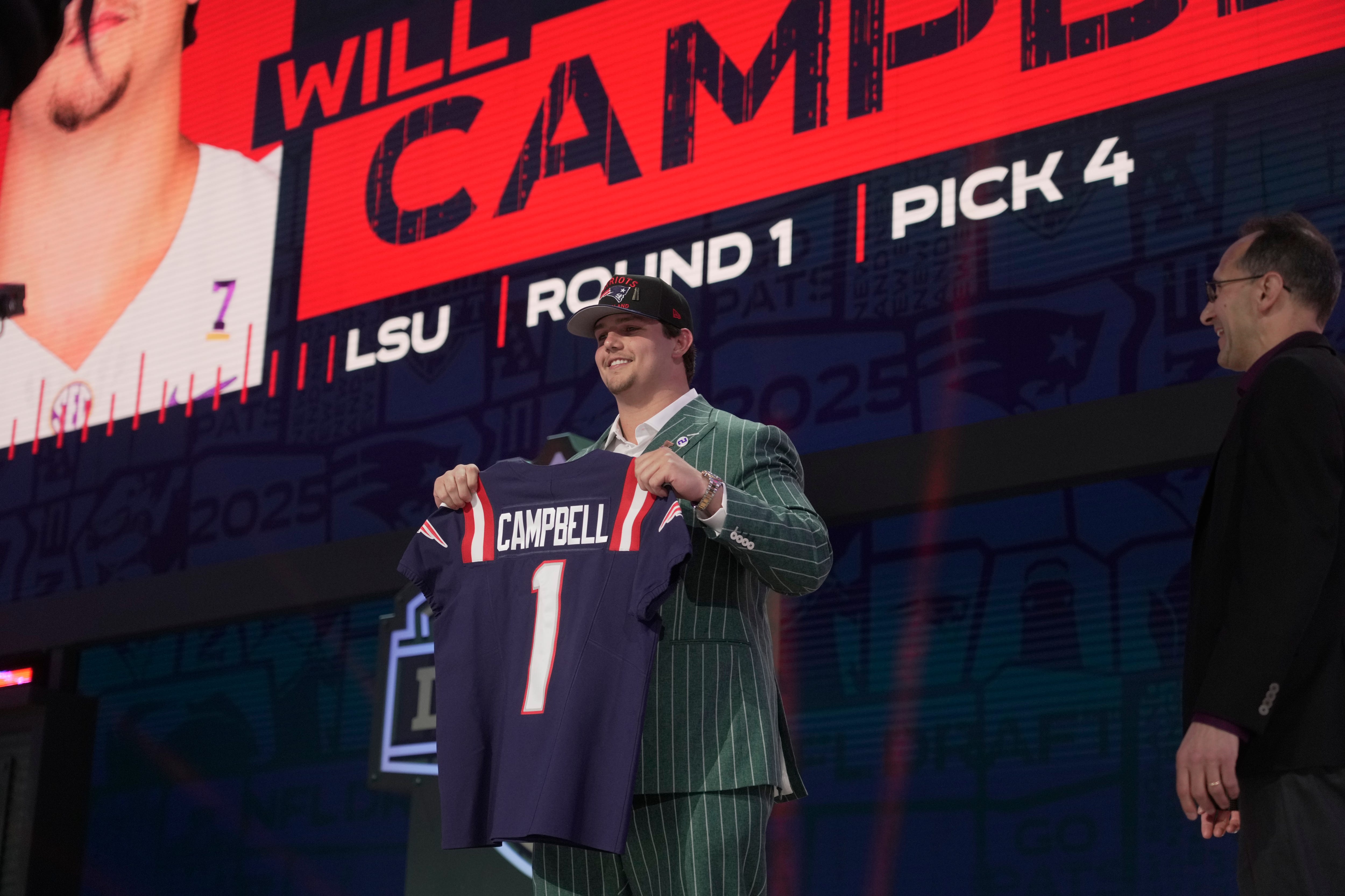 Offensive Tackle Will Campbell of LSU poses after he is selected by the New England Patriots as the number four pick in the first round of the 2025 NFL Draft at Lambeau Field.