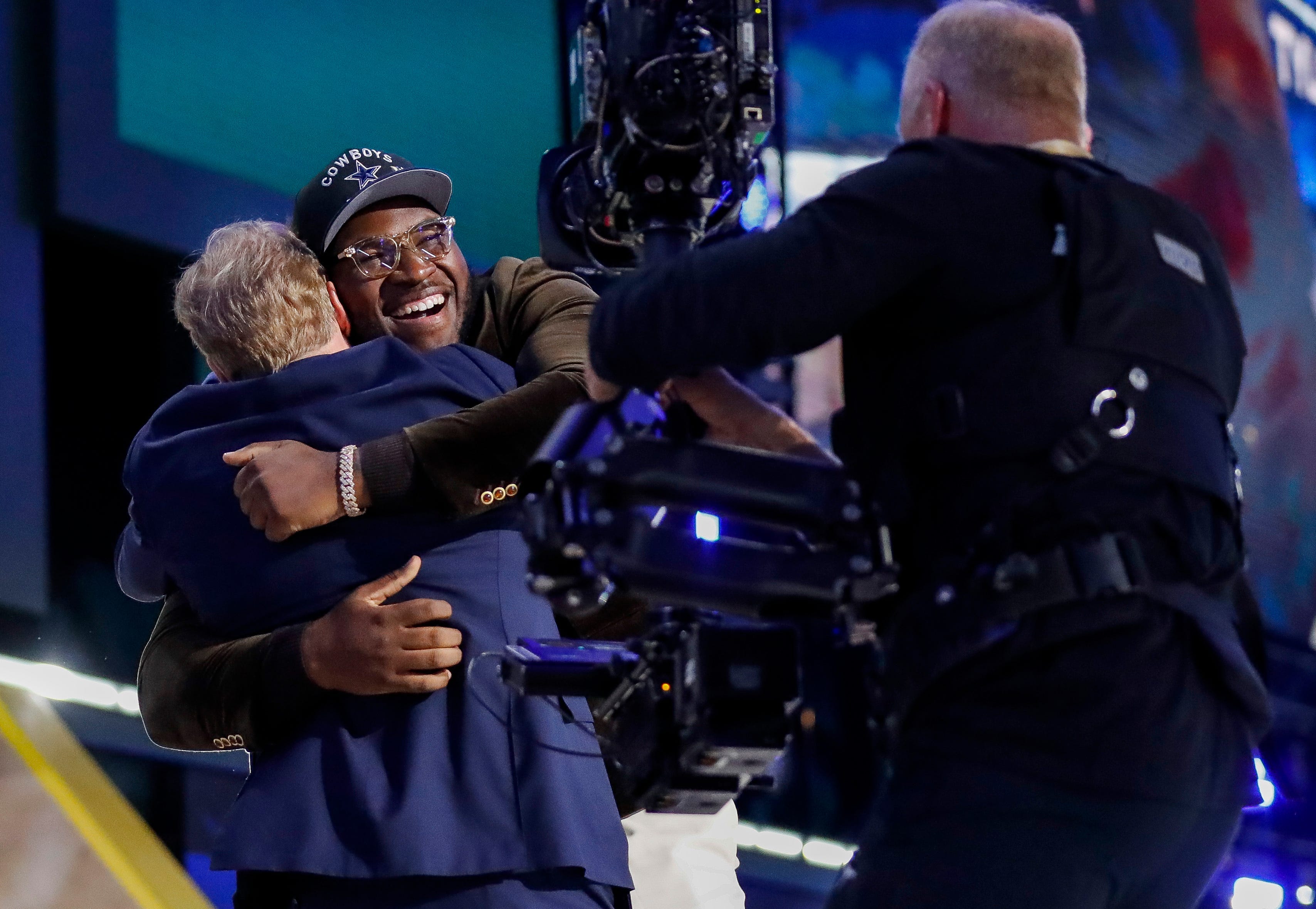 Offensive lineman Tyler Booker embraces NFL Commissioner Roger Goodell after being selected 12th overall by the Dallas Cowboys during the first round of the 2025 NFL Draft on Thursday, April 24, 2025, at Lambeau Field in Green Bay, Wisconsin.