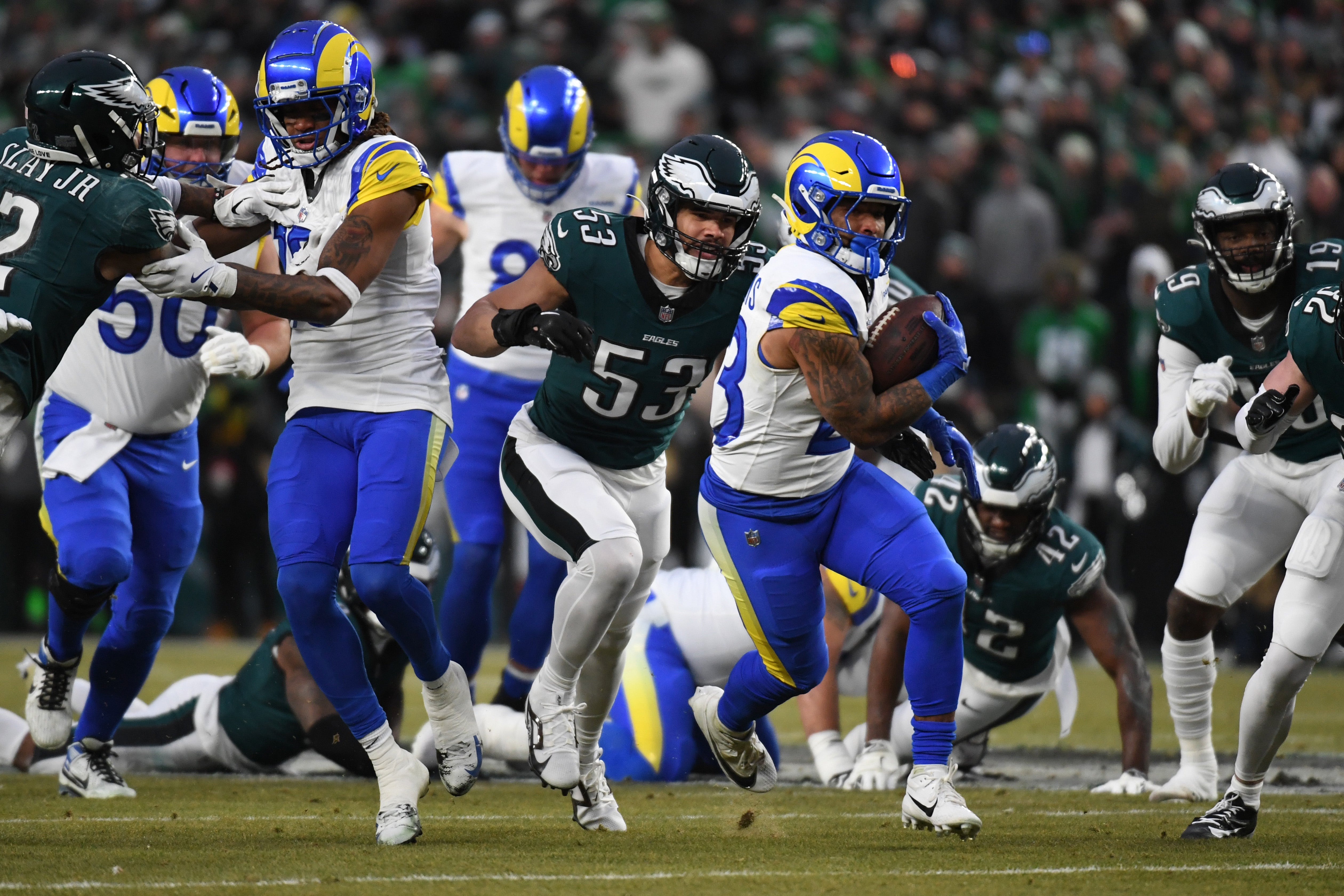 Jan 19, 2025; Philadelphia, Pennsylvania, USA; Los Angeles Rams running back Kyren Williams (23) carries the ball past Philadelphia Eagles linebacker Zack Baun (53) in a 2025 NFC divisional round game at Lincoln Financial Field.