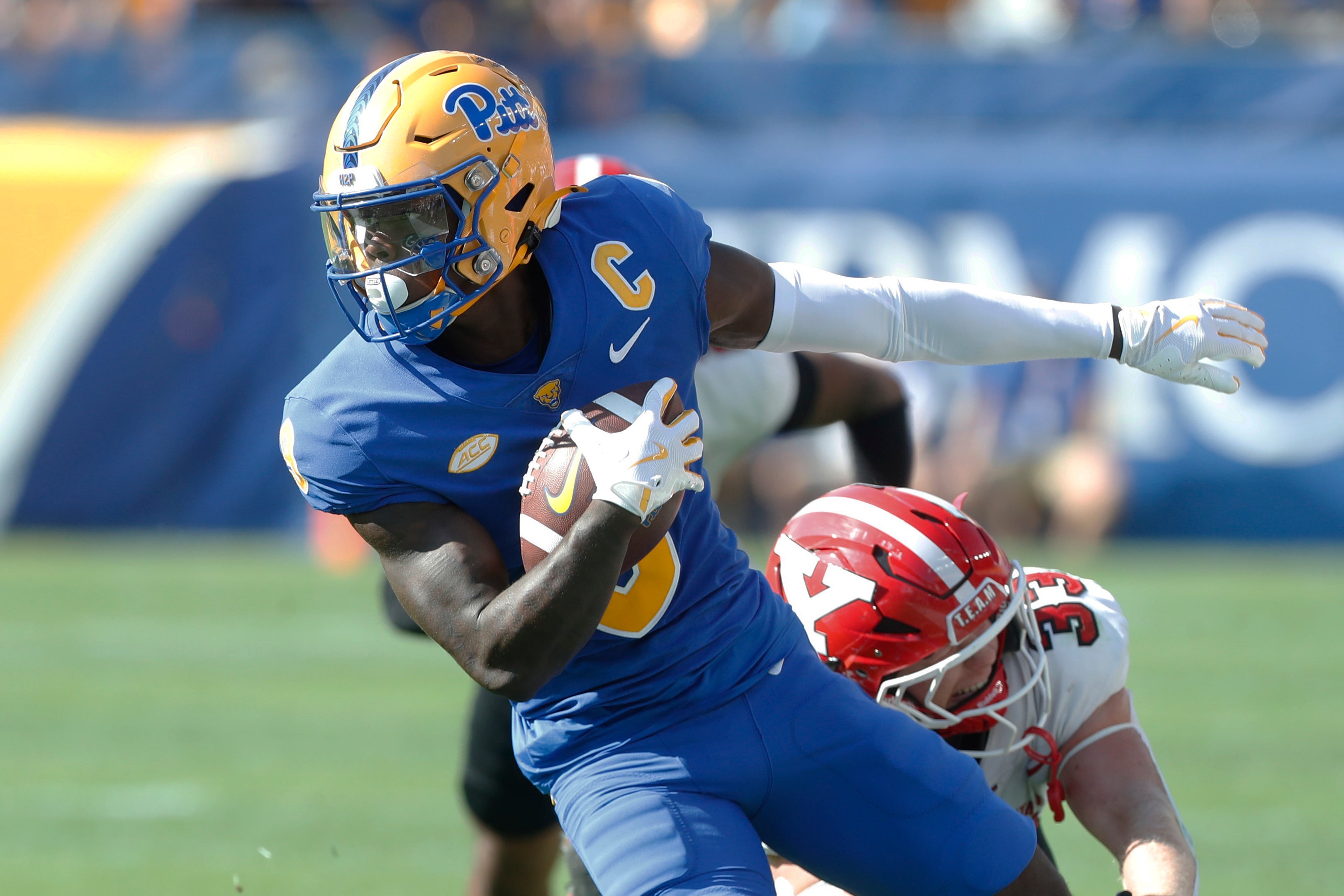 Sep 21, 2024; Pittsburgh, Pennsylvania, USA; Pittsburgh Panthers wide receiver Konata Mumpfield (9) runs after a catch against the Youngstown State Penguins during the first quarter at Acrisure Stadium.