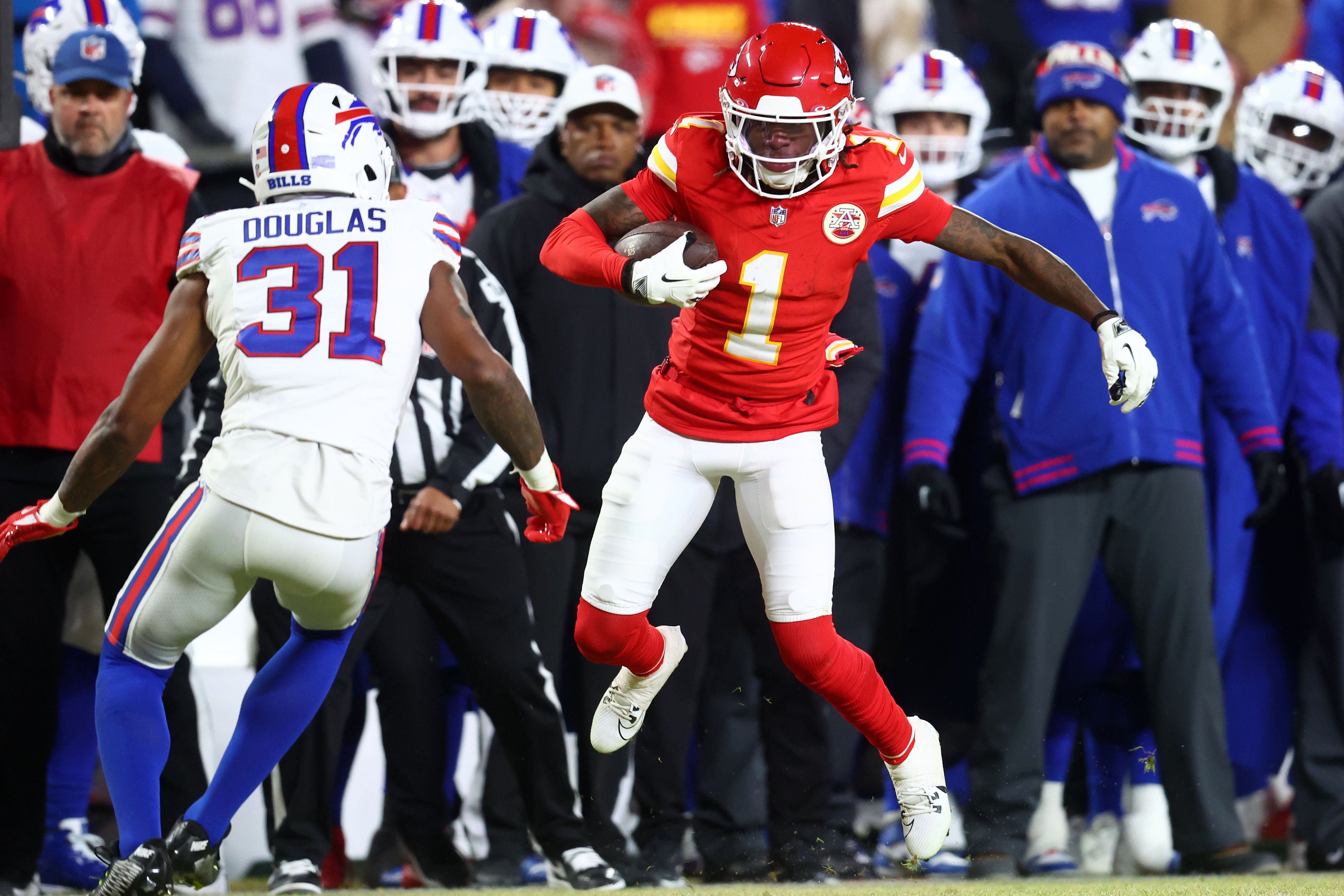 Jan 26, 2025; Kansas City, MO, USA; Kansas City Chiefs wide receiver Xavier Worthy (1) makes a catch against Buffalo Bills cornerback Rasul Douglas (31) during the first half in the AFC Championship game at GEHA Field at Arrowhead Stadium.