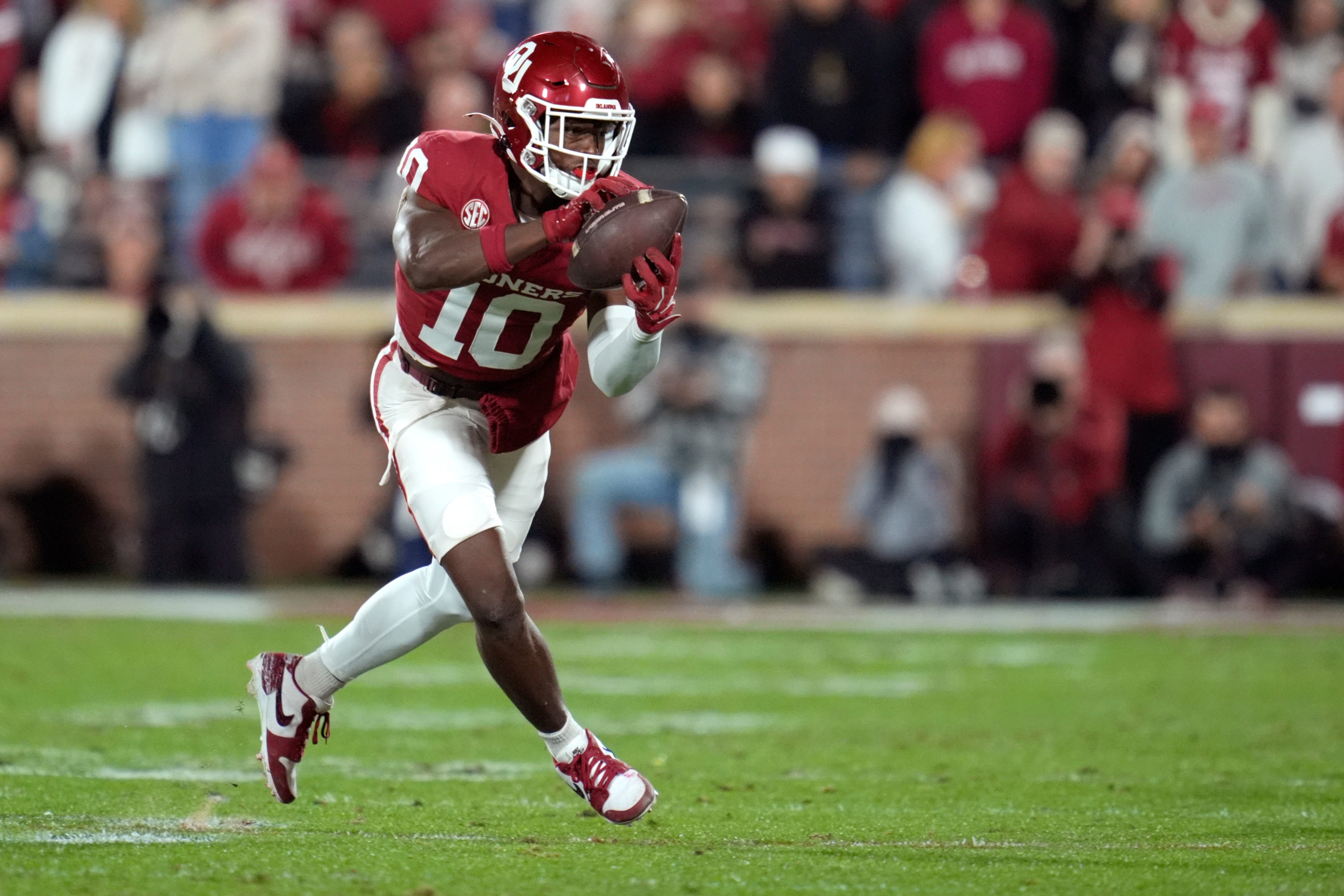 Oklahoma Sooners linebacker Kip Lewis (10) intercepts a pass and returns it for a touchdown during a college football game between the University of Oklahoma Sooners (OU) and the Alabama Crimson Tide at Gaylord Family - Oklahoma Memorial Stadium in Norman, Okla., Saturday, Nov. 23, 2024. Oklahoma won 24-3.