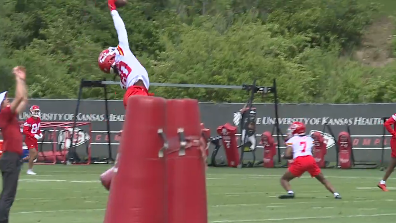 Chiefs CB Nohl Williams goes up to get a one-handed interception against an unsuspecting coach during rookie minicamp practice.