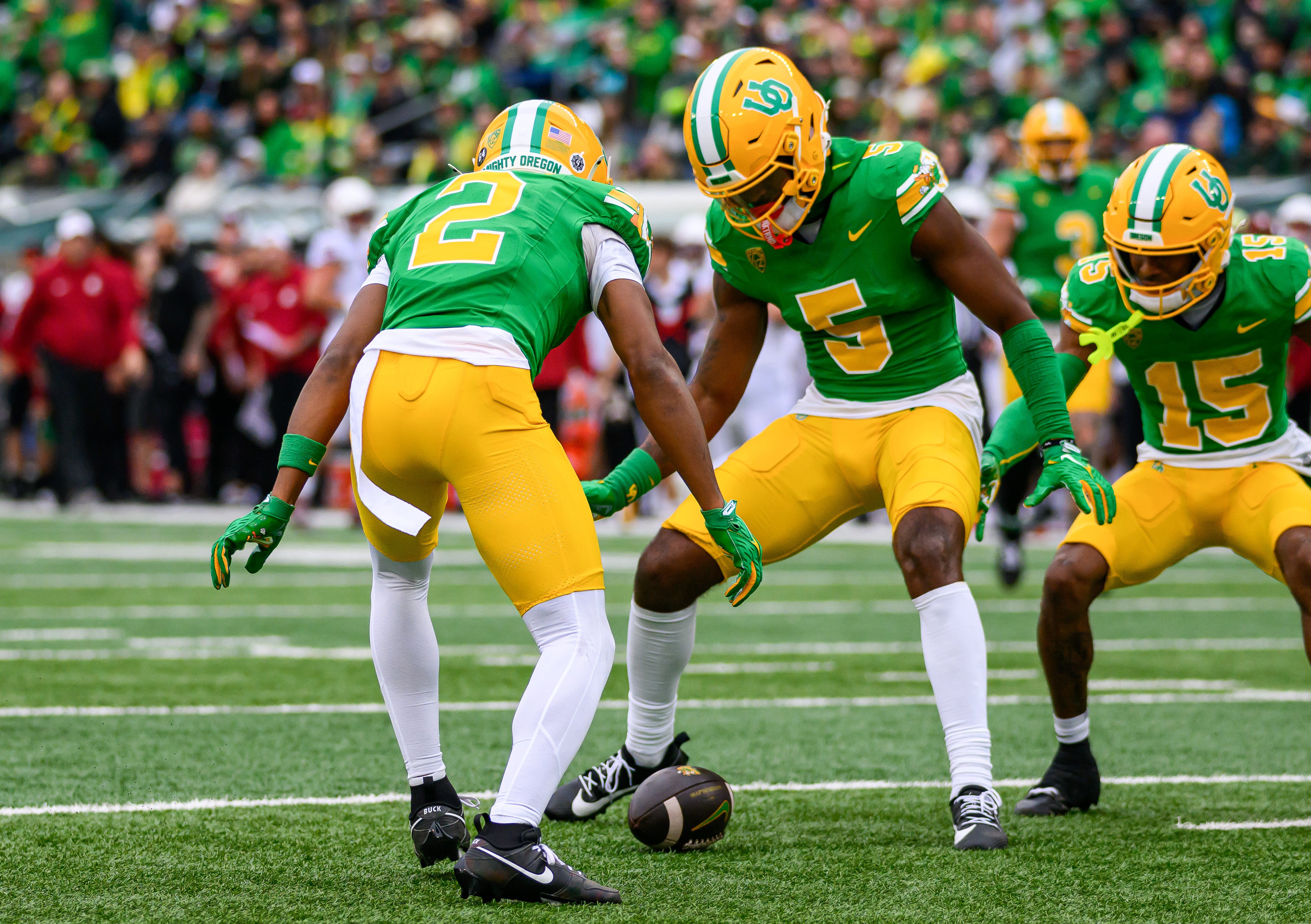 Oct 21, 2023; Eugene, Oregon, USA; Oregon Ducks linebacker Jeffrey Bassa (2) defensive back Khyree Jackson (5) down a punt inside the 5 yard line during the second quarter against the Washington State Cougars at Autzen Stadium.