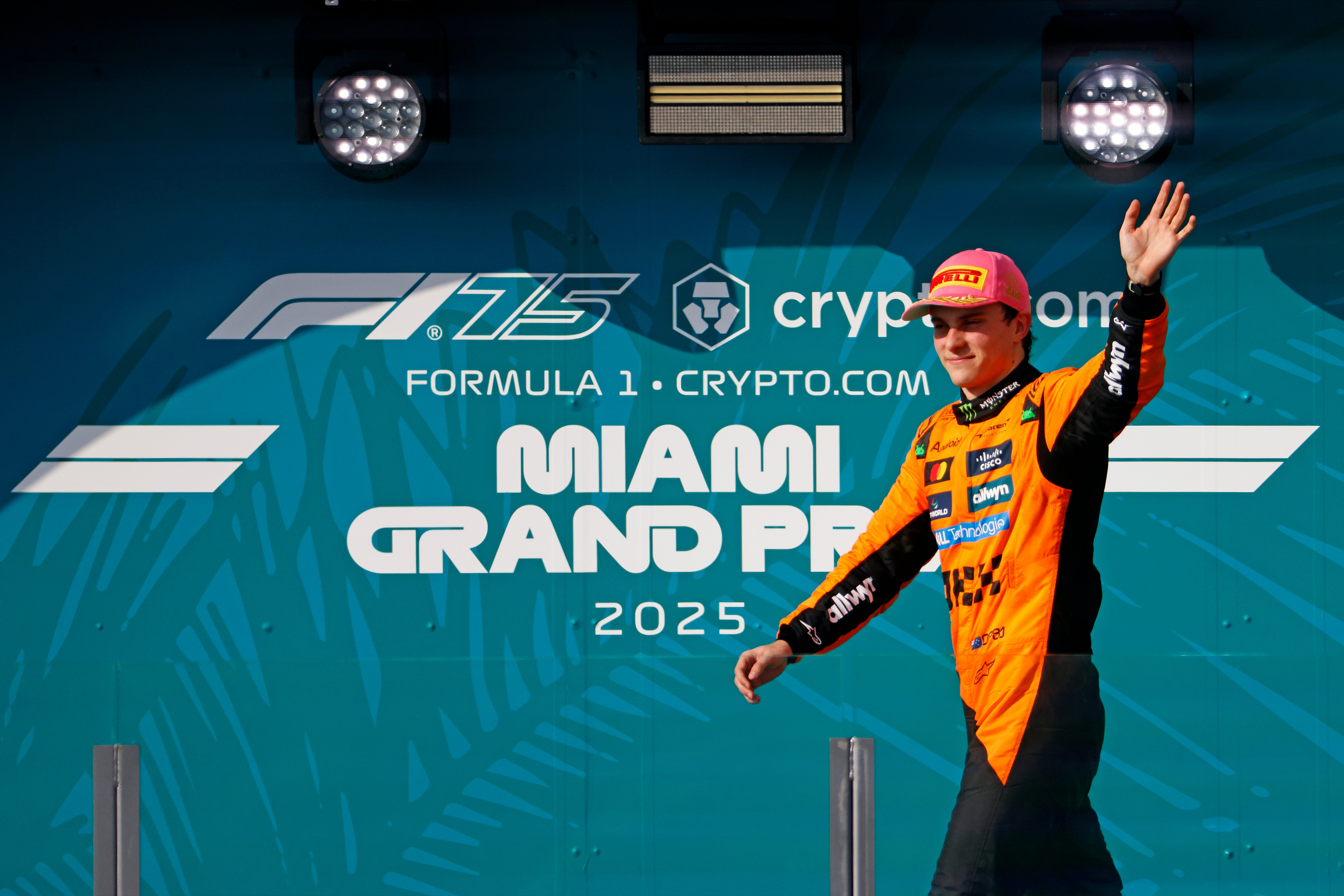 May 4, 2025; Miami Gardens, FL, USA; McLaren driver Oscar Piastri (81) walks to the podium after winning the F1 Miami Grand Prix at Miami International Autodrome.