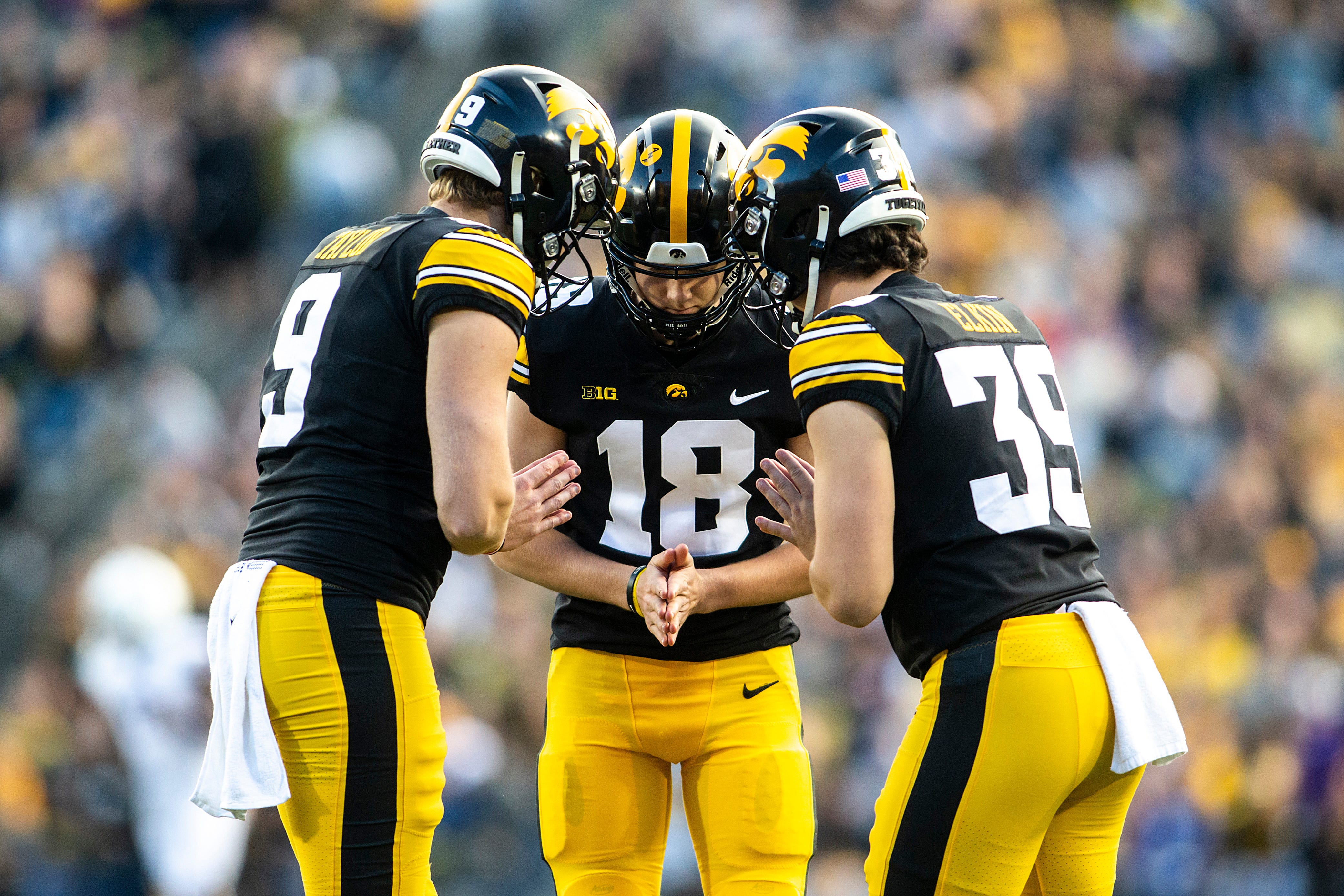 Iowa holder Tory Taylor, left, placekicker Drew Stevens, center, and long snapper Luke Elkin react after a field goal during a NCAA Big Ten Conference football game against Northwestern, Saturday, Oct. 29, 2022, at Kinnick Stadium in Iowa City, Iowa. 221029 Northwestern Iowa Fb 054 Jpg