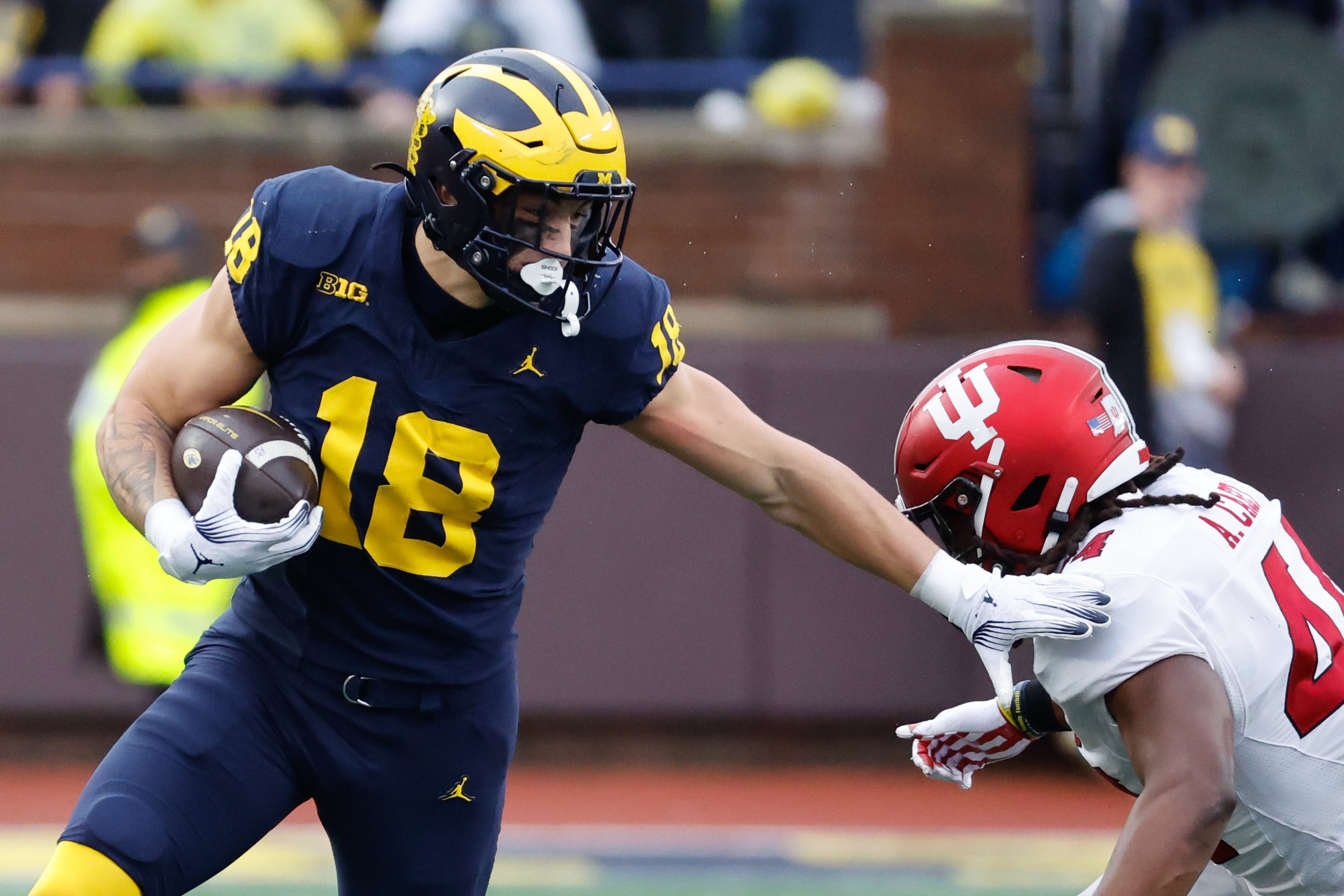 Oct 14, 2023; Ann Arbor, Michigan, USA; Michigan Wolverines tight end Colston Loveland (18) runs the ball in the first half against the Indiana Hoosiers at Michigan Stadium.