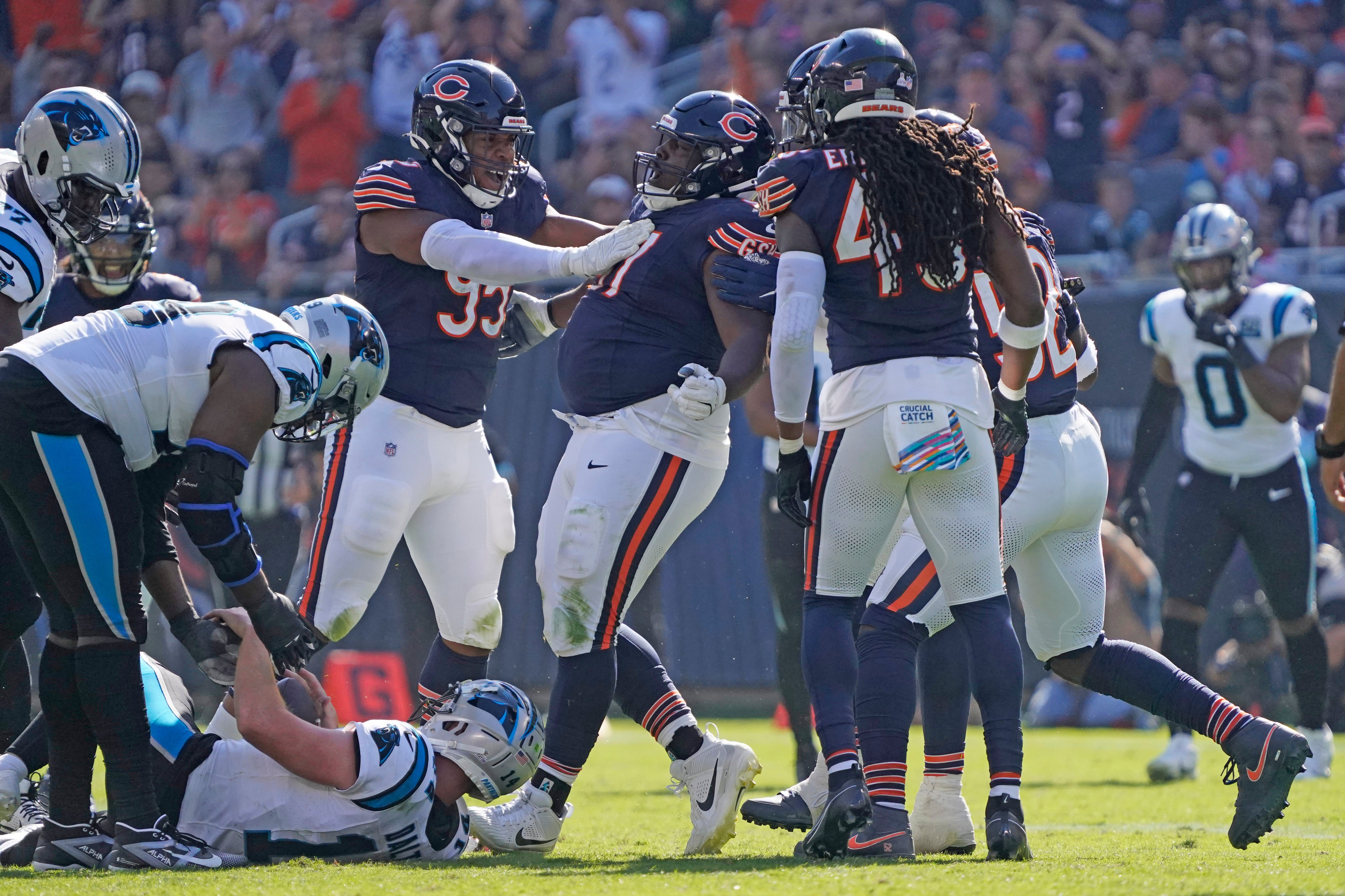 Oct 6, 2024; Chicago, Illinois, USA; Chicago Bears defensive tackle Andrew Billings (97) sacks Carolina Panthers quarterback Andy Dalton (14) during the second half at Soldier Field.