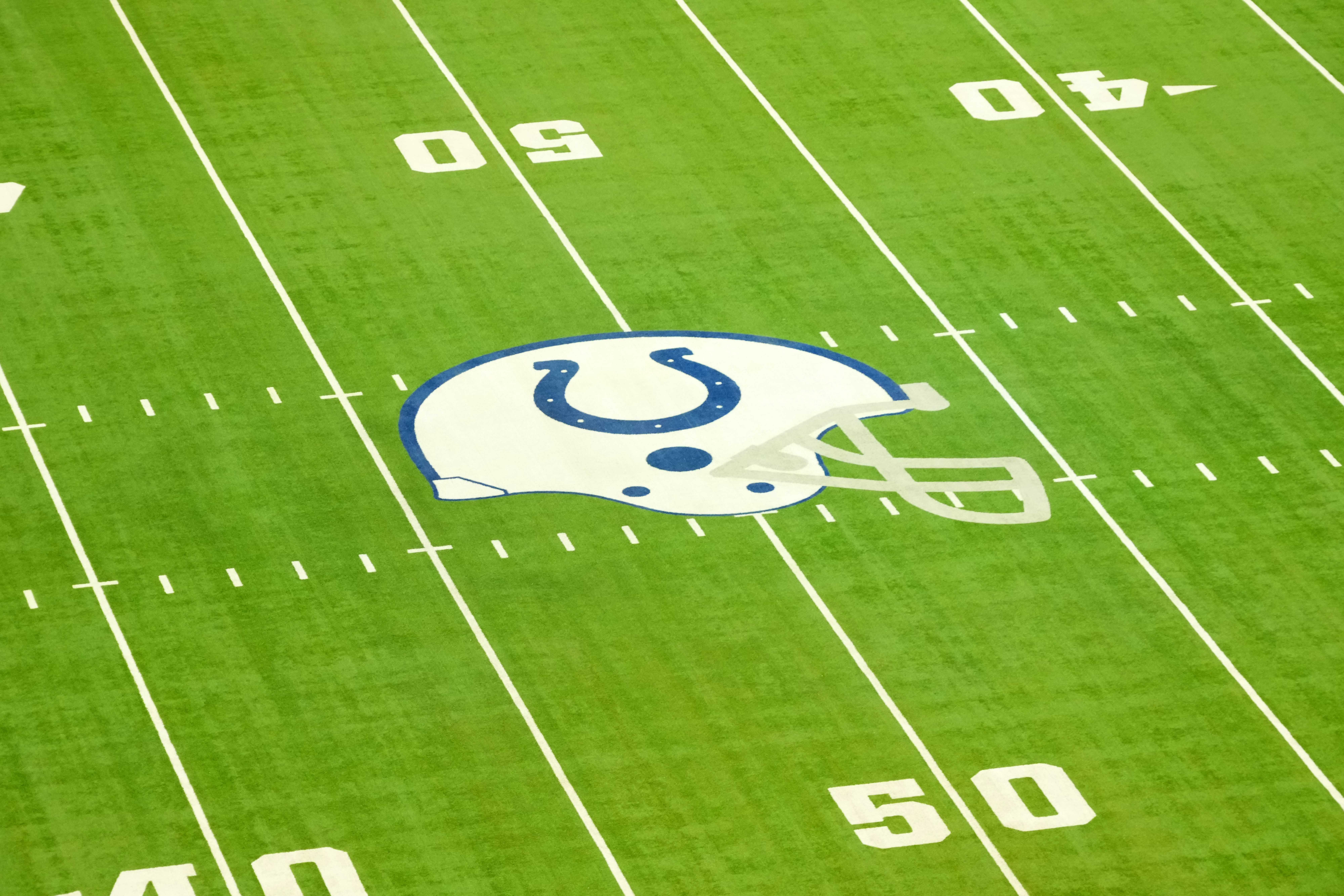 Feb 25, 2025; Indianapolis, IN, USA; The Indianapolis Colts helmet logo at midfield at Lucas Oil Stadium.